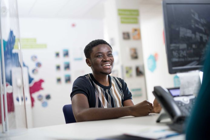 Student talking to staff at the Student Support Zone.