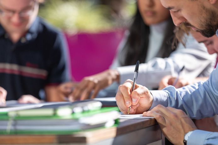 Students writing in Dalby Cour