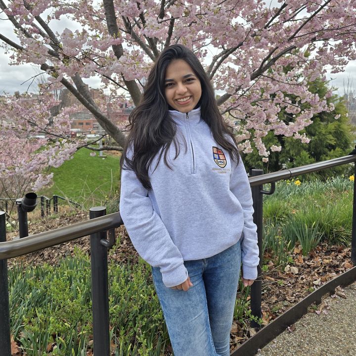 Vitree standing in front of a cherry tree