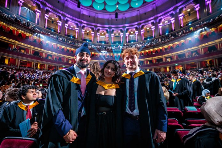 The students from the Faculty of Natural Sciences, posing inside the Royal Albert Hall in their academic dress.