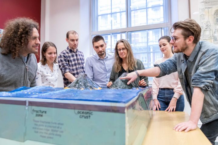 Students standing around Dr Stephen Hicks