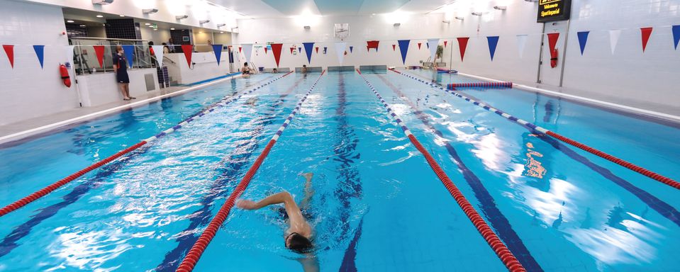 A man swimming in Ethos swimming pool