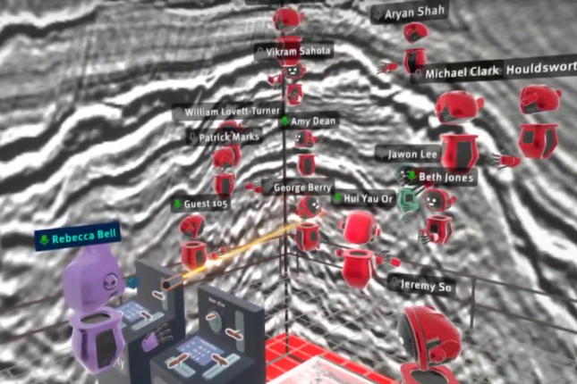 A screenshot from inside ViRSE, a virtual reality learning platform at Imperial College. Students and a lecturer are inside a cube whose walls are covered with black and white seismic data, allowing them to navigate through the 3D seismic data as if they were inside of it. The lecturer uses a laser pointer to point at a point of interest in the data.