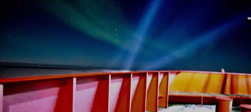 Aurora Australis and search lights