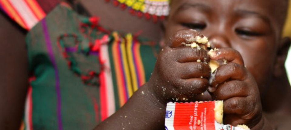 African child receiving Ready-to-Use Therapeutic Food 3836x1720