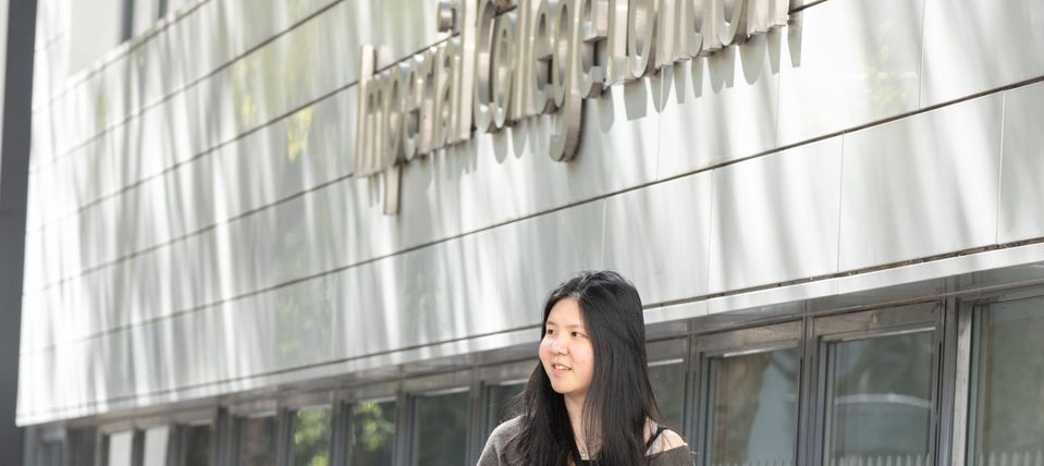 A student walking on campus.