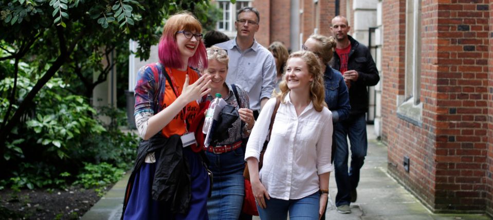 A student volunteer conducting a campus tour.