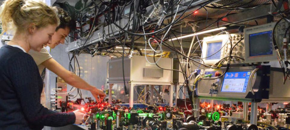 Two researchers working in the physics labs