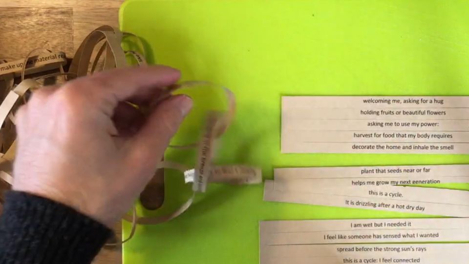 Man creates linked paper chains with poems