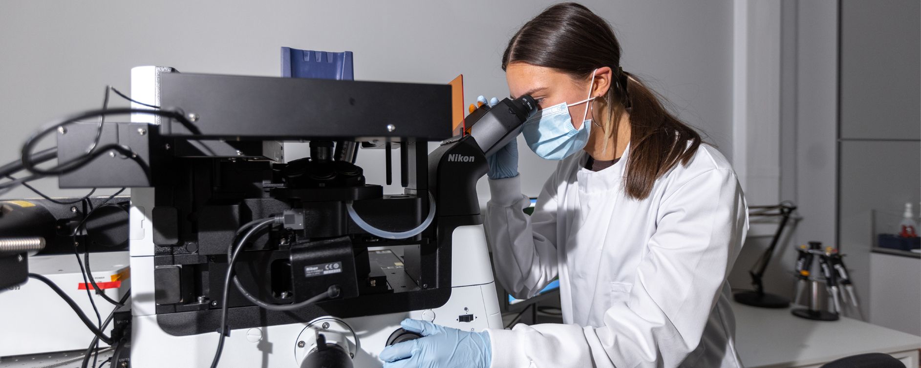 Researcher using the super resolution microscope in the lab