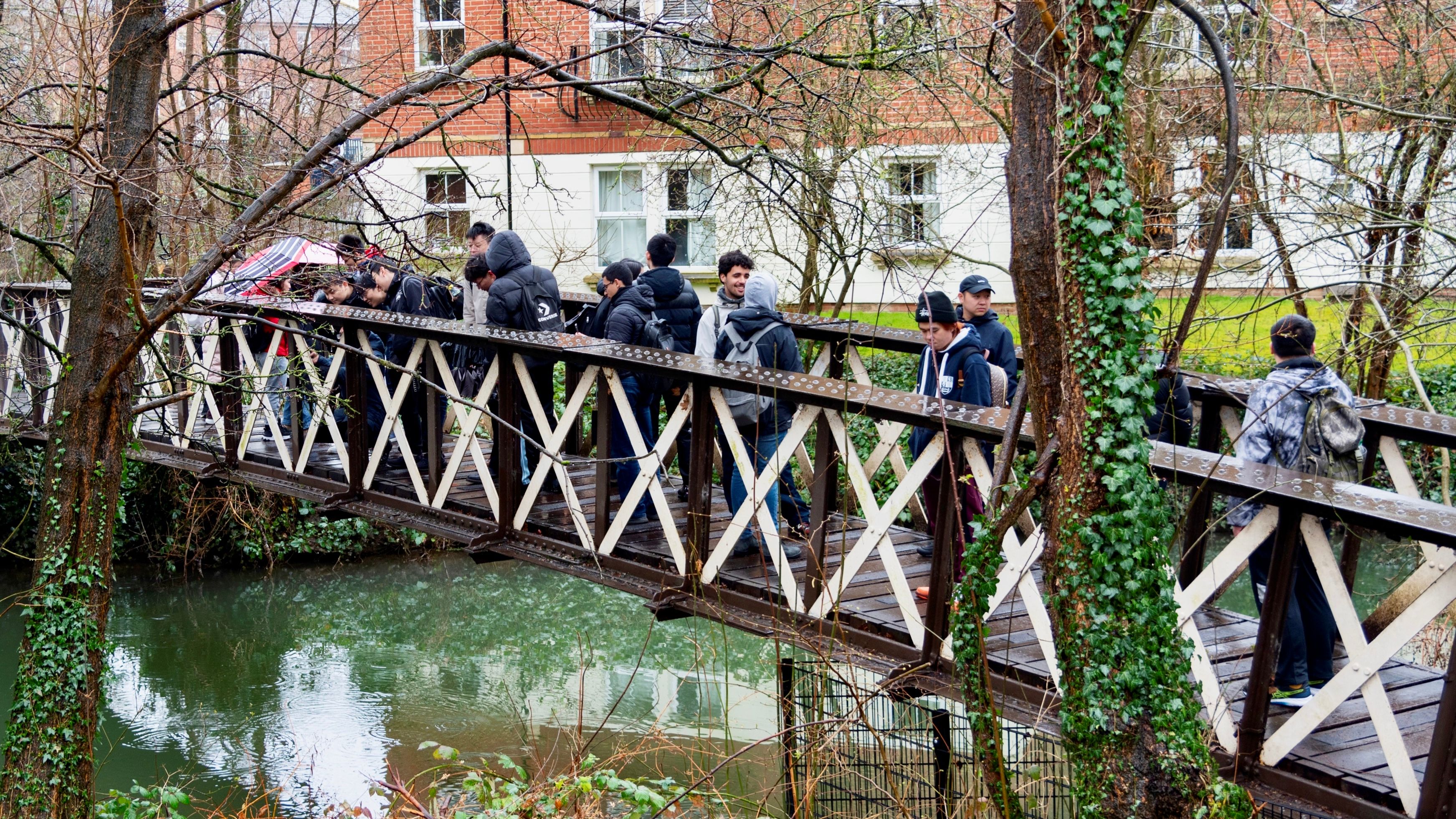 Figure shows MSc students are doing survey on a bridge