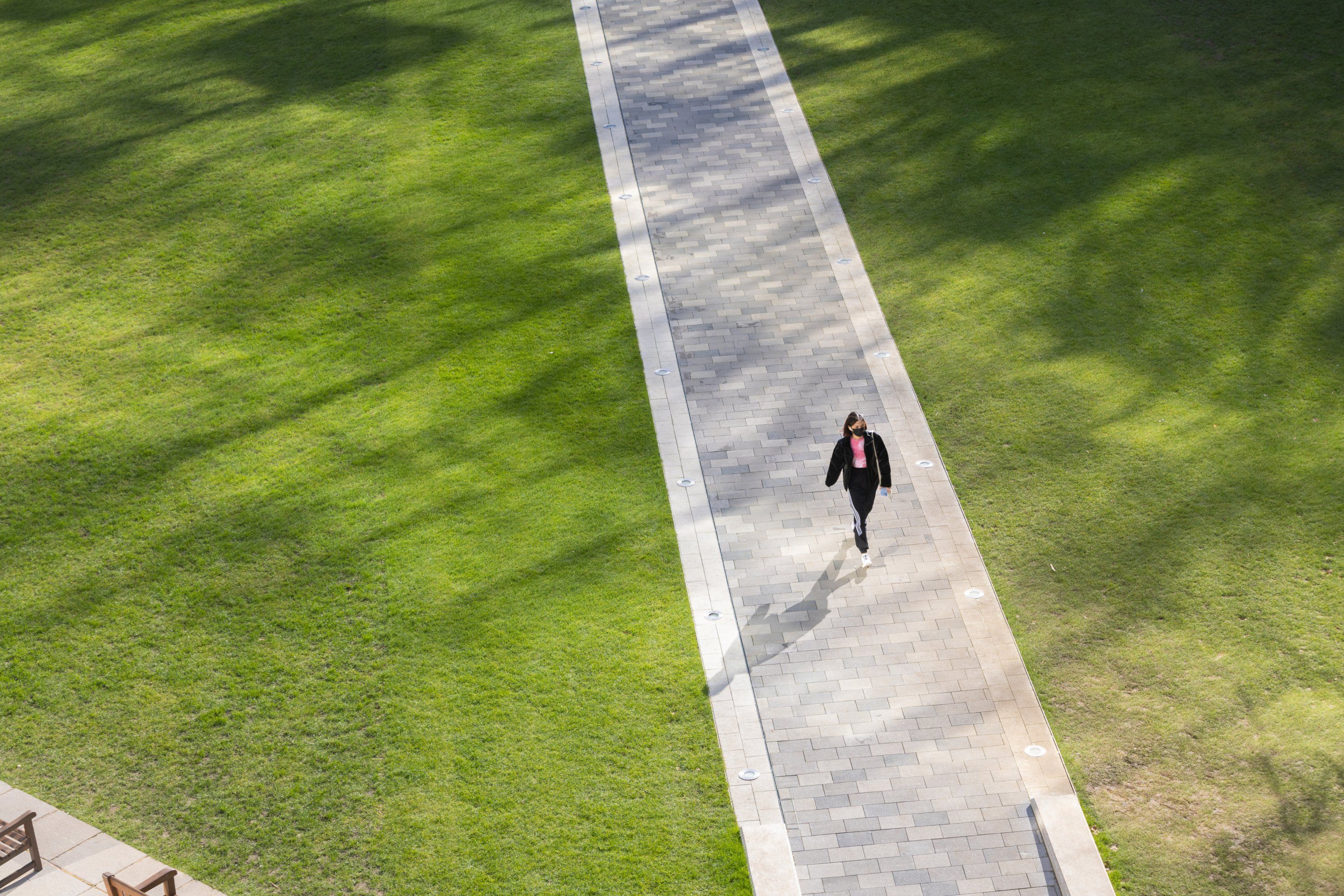 Student walking through campus at Imperial College London