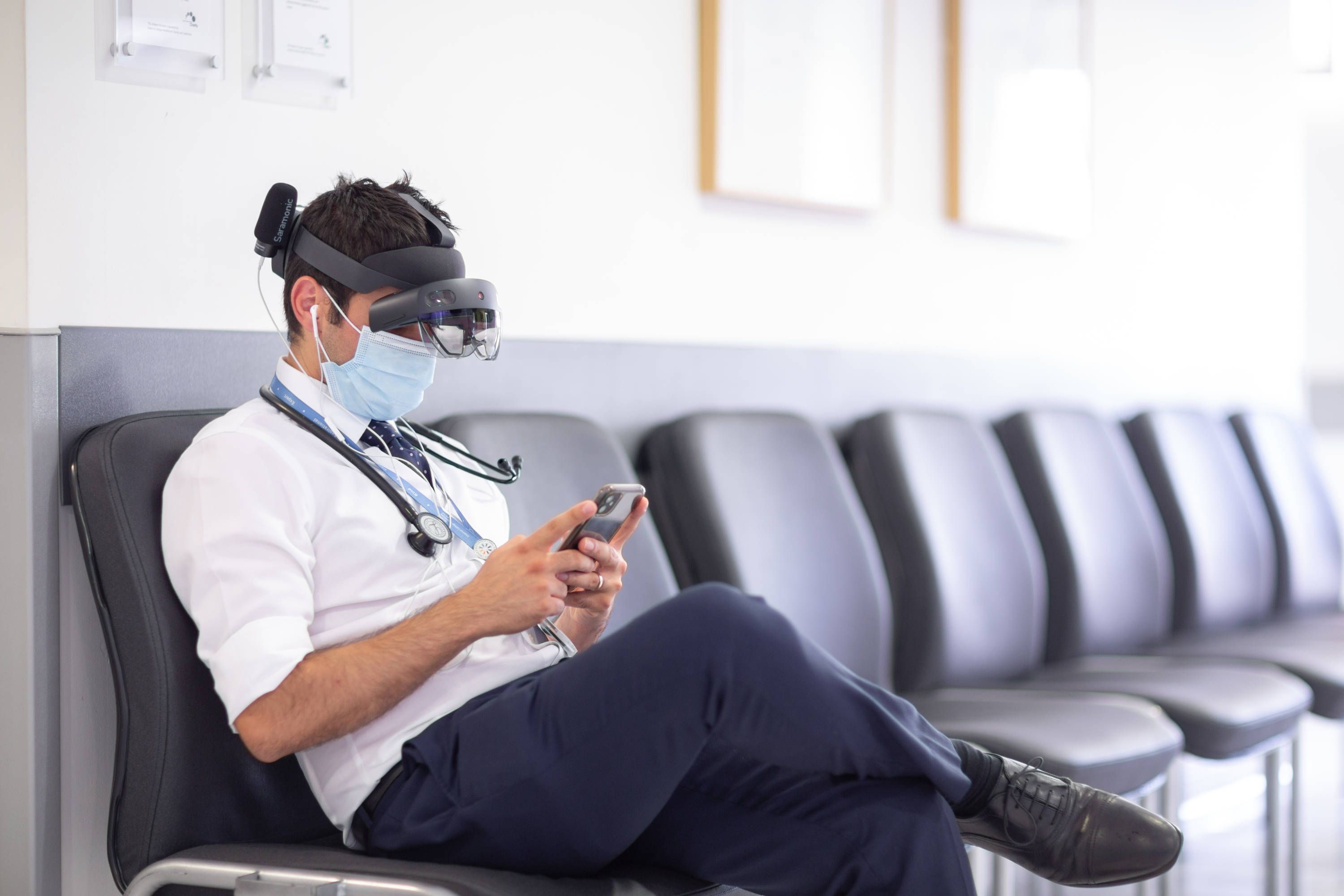 Member of staff working on phone using Microsoft Hololens