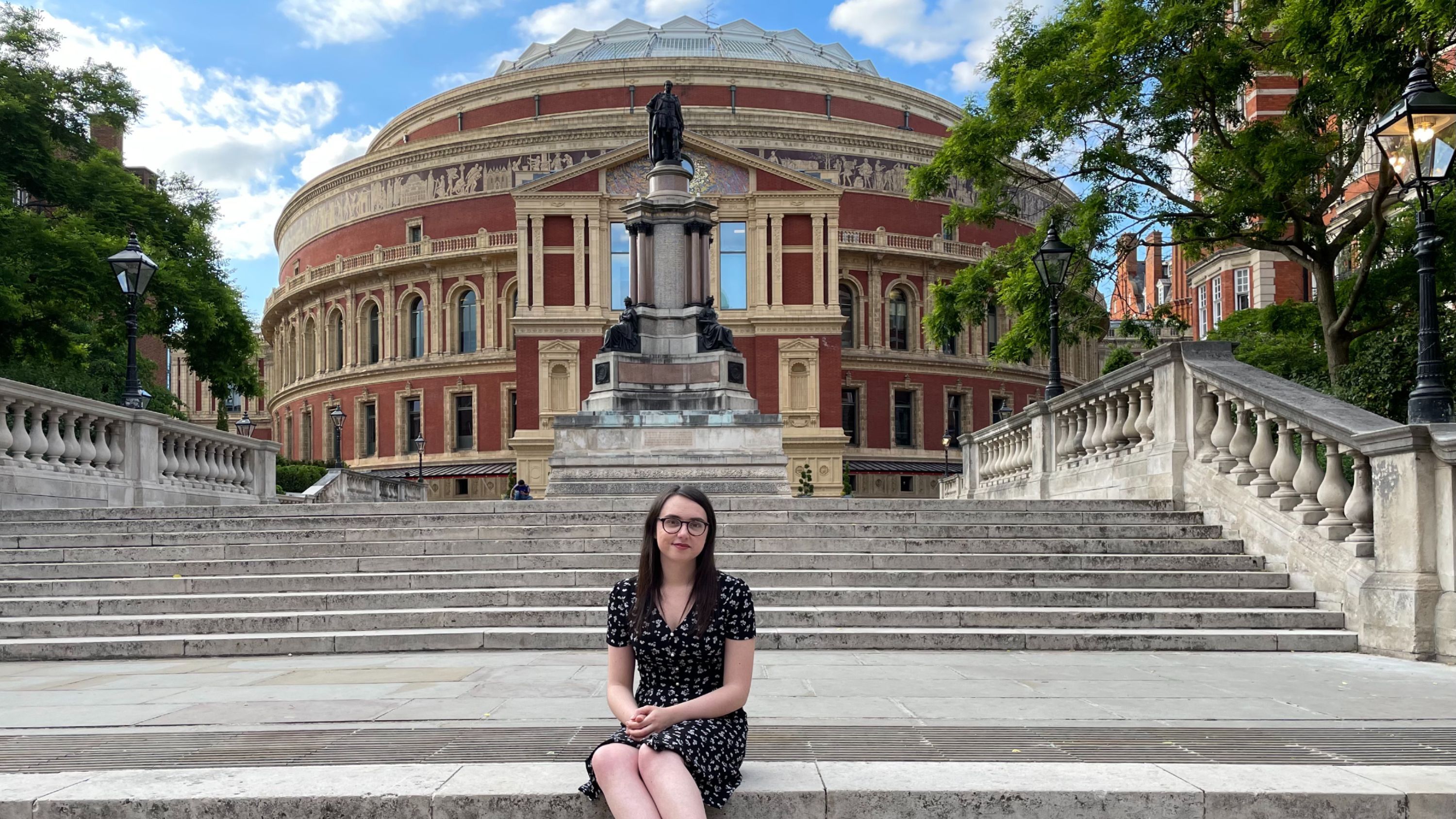 Emilia sitting in front of the Albert Hall