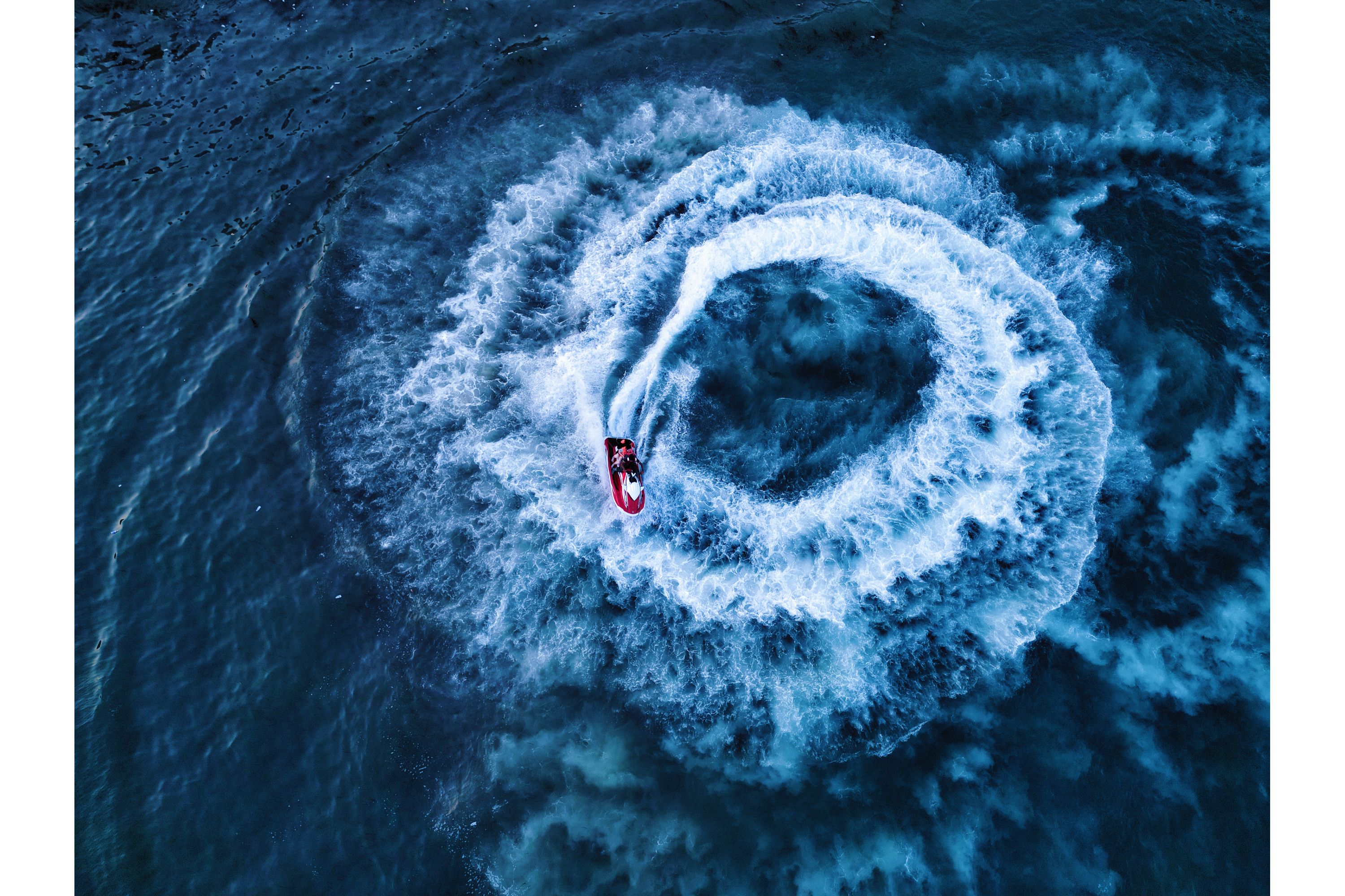 A drone shot of a speedboat