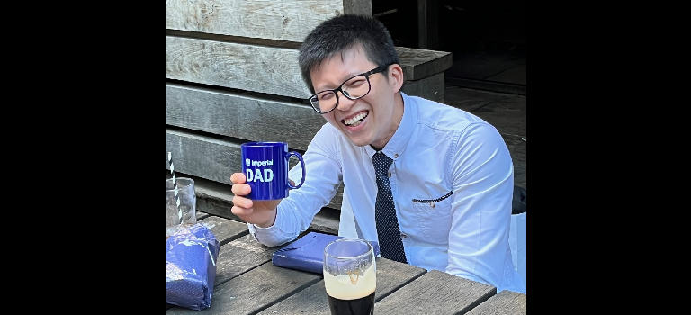 Jin celebrating his viva success with an Imperial Dad mug