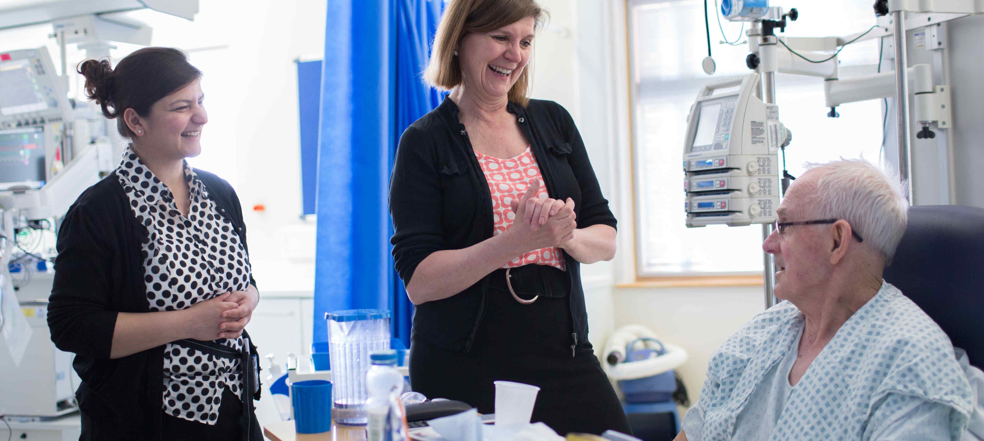 Professor Alison Holmes with a patient