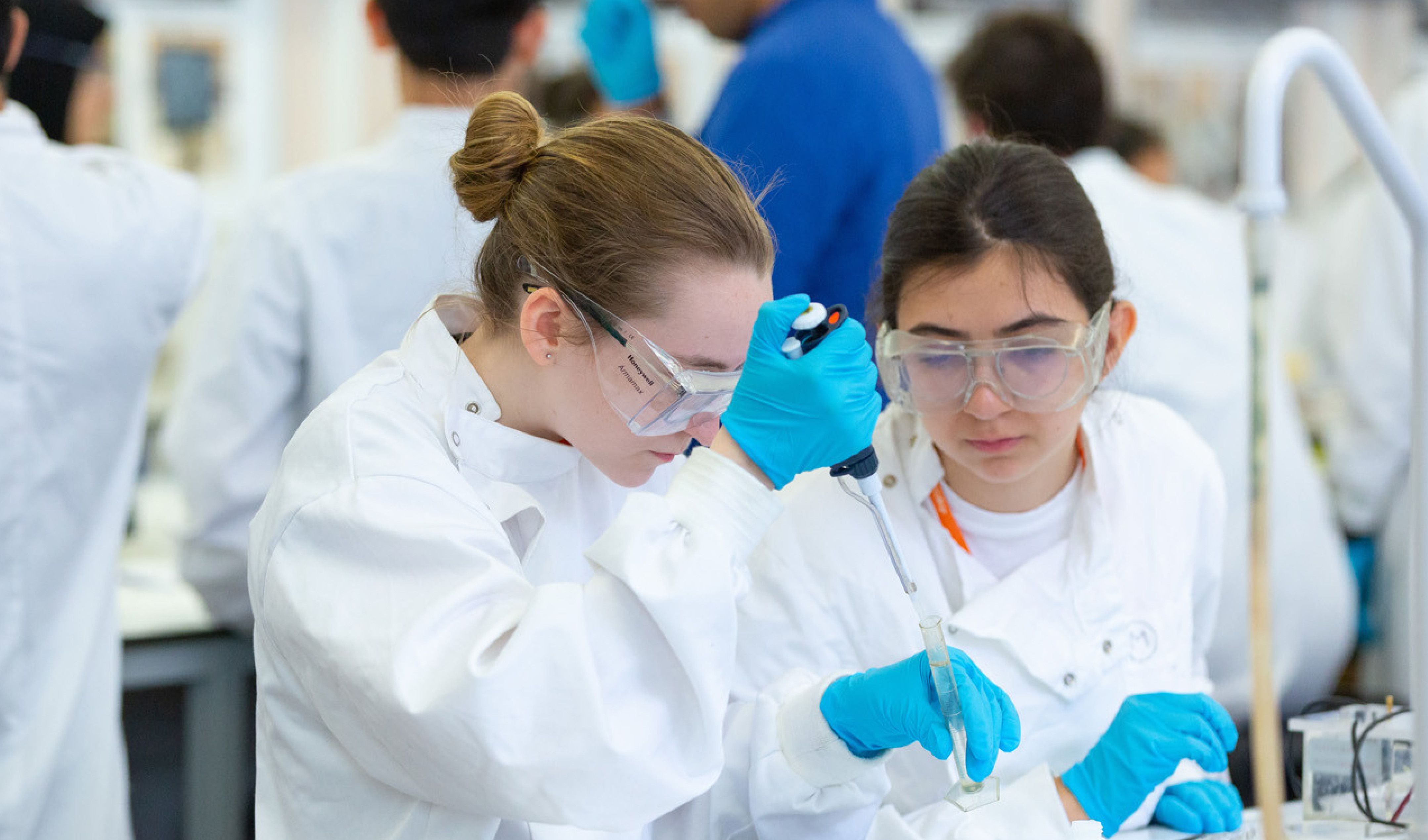 Two young women experimenting in the lab