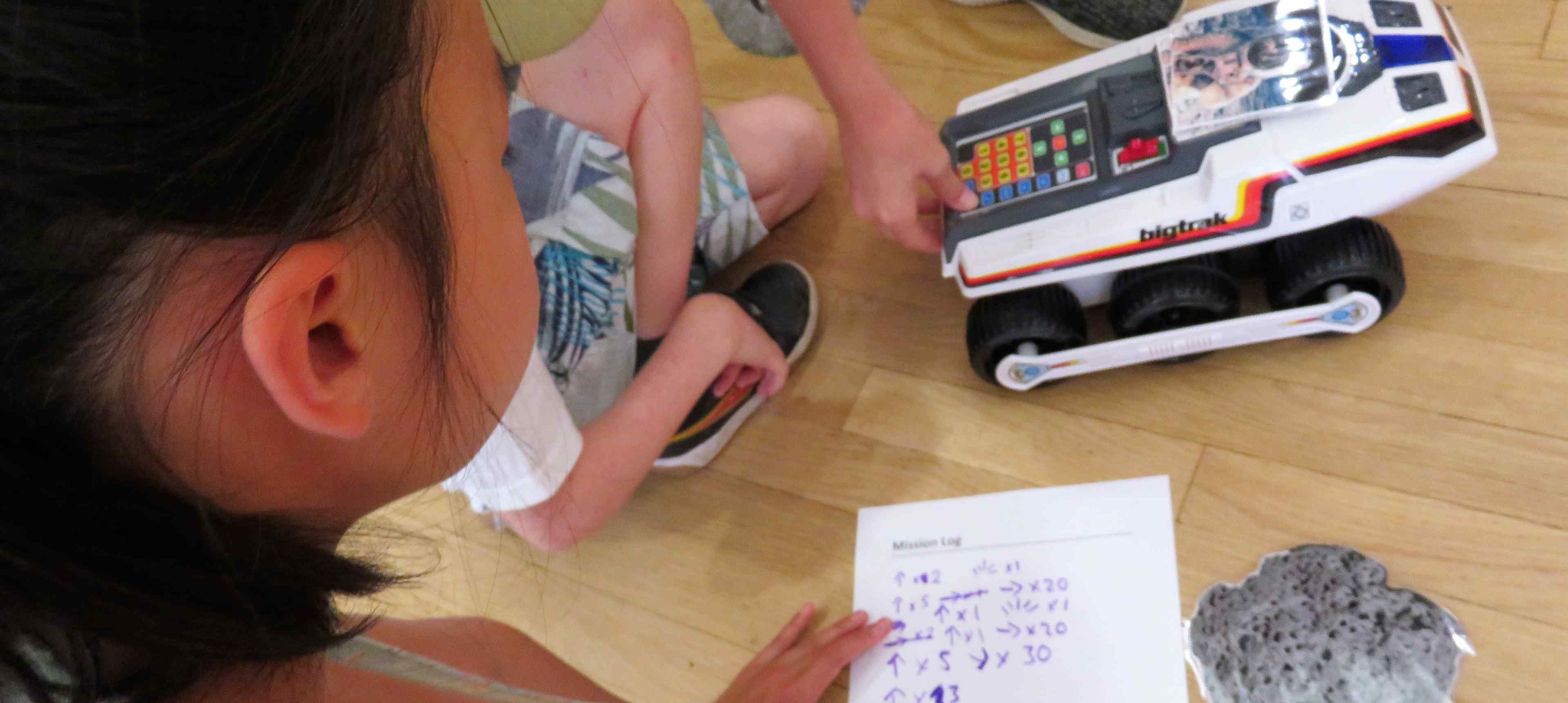 Children planning the direction of the robot