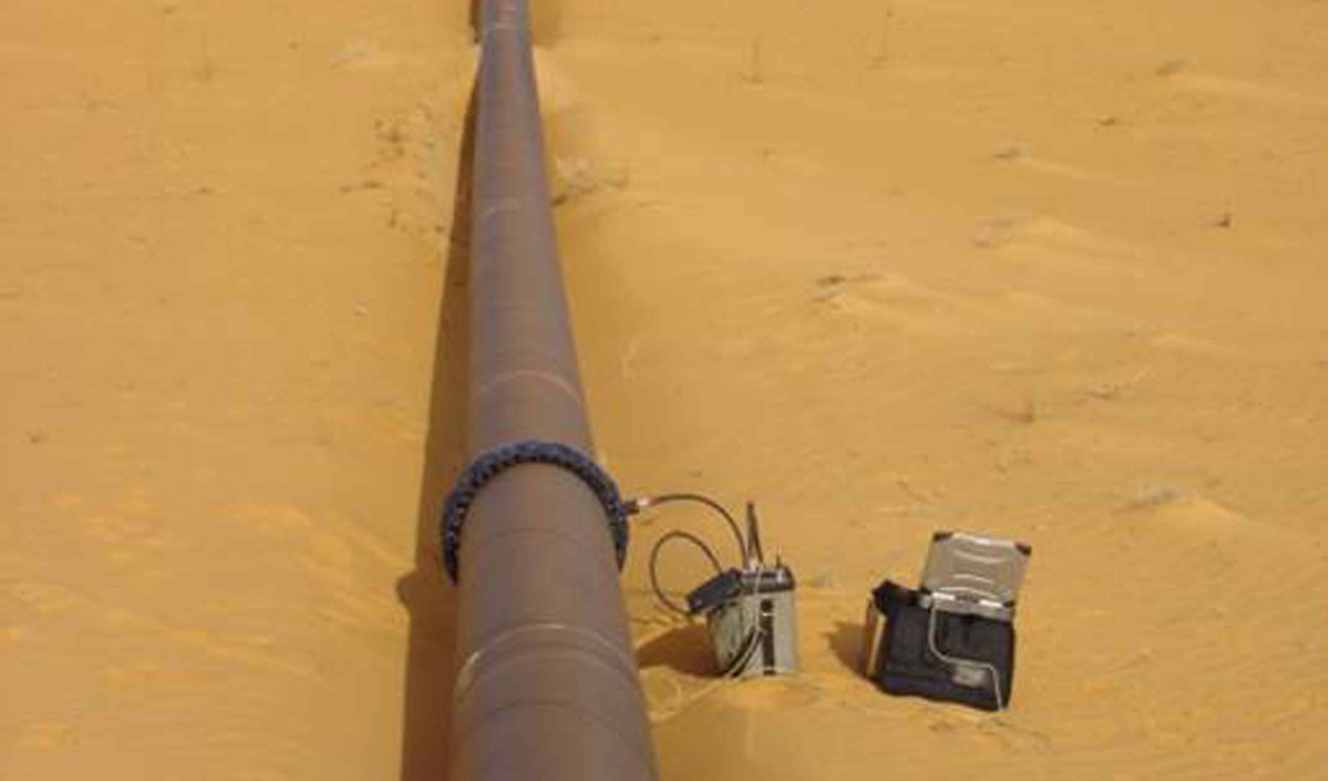 A pipe linked to a sensor array and test equipment in the desert