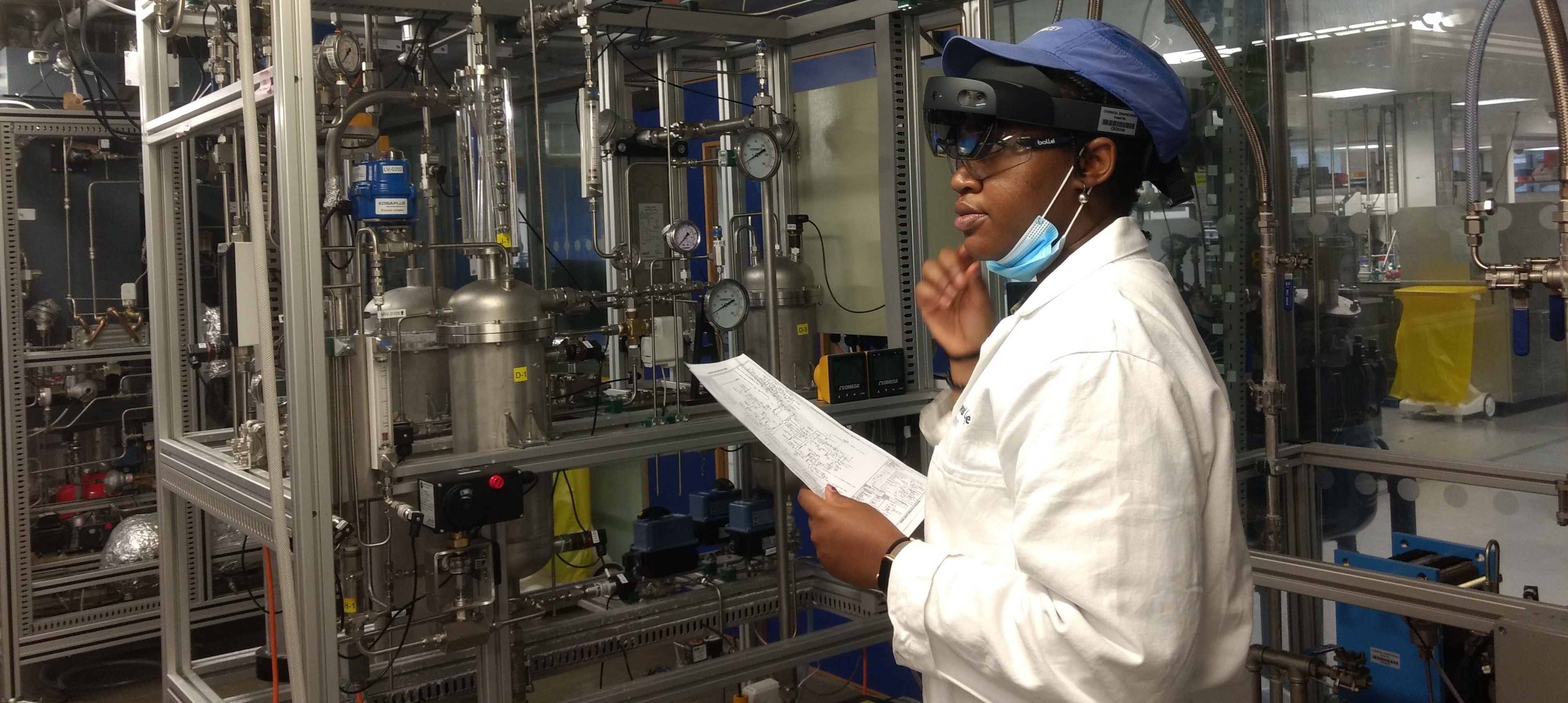 Female student with a Hololens headset in the pilot plant