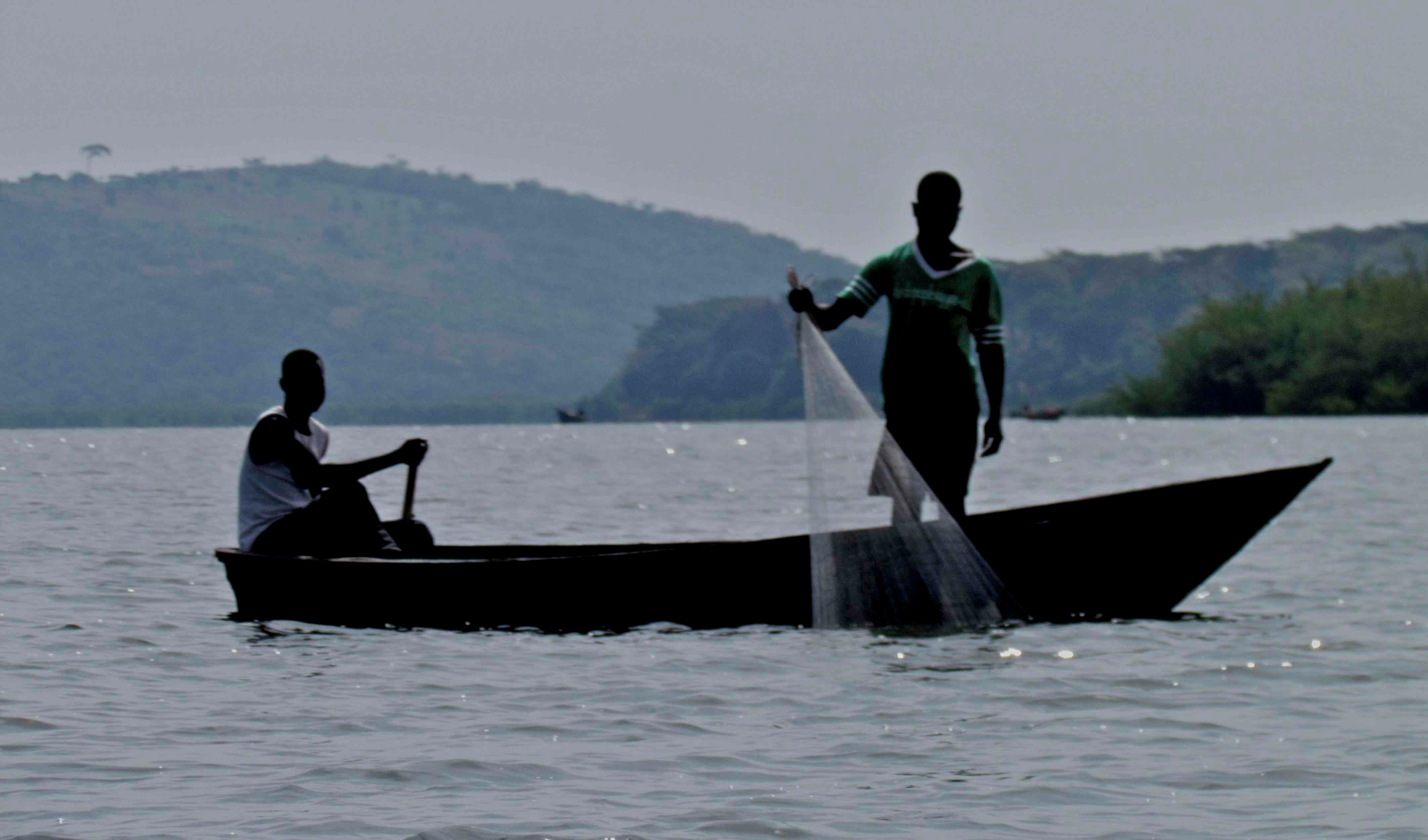 Entebbe fisherman using traditional methods