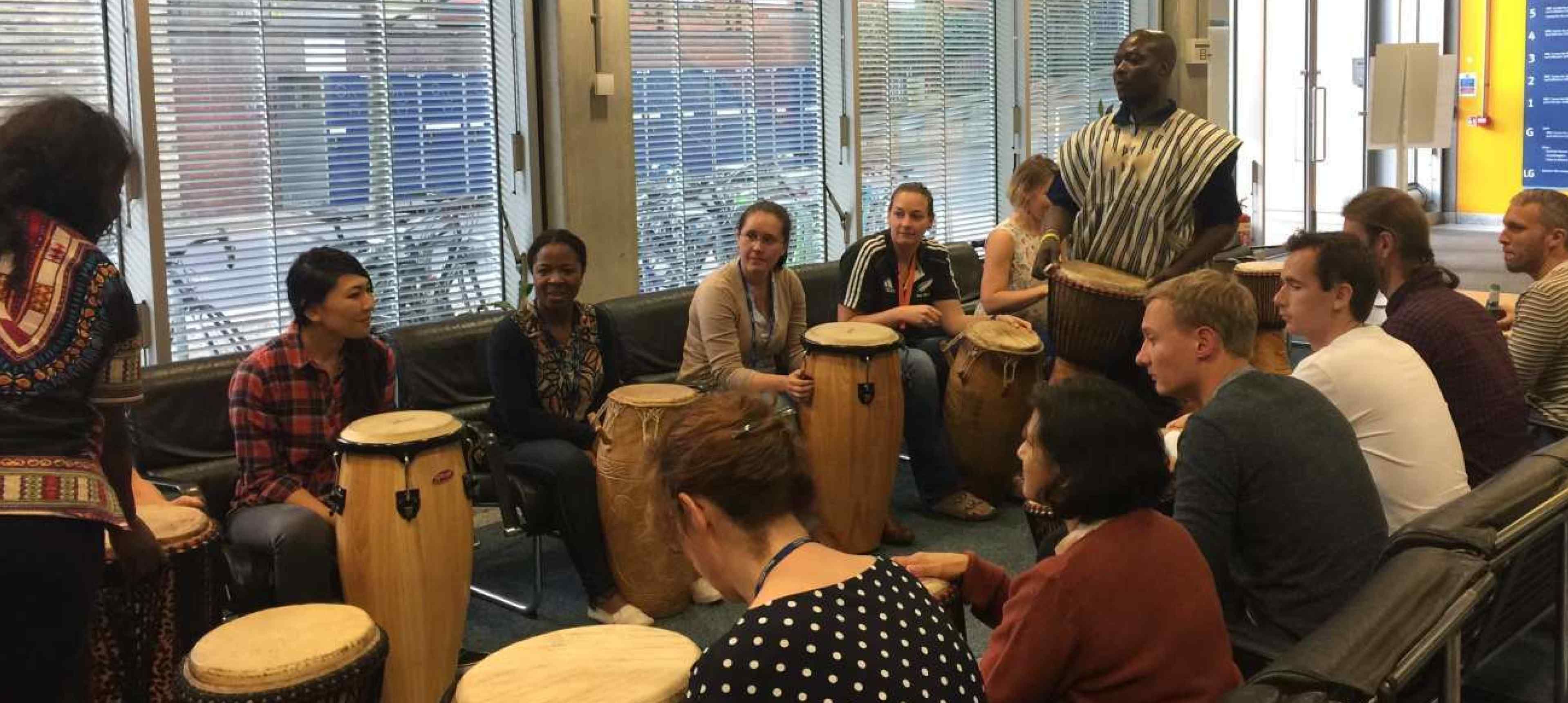 Postdocs enjoying the African drumming lesson