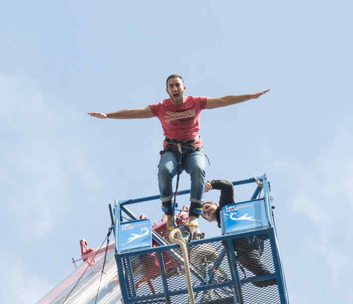 Student jumping off the bungee crane