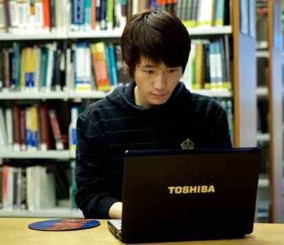 Student working at a laptop