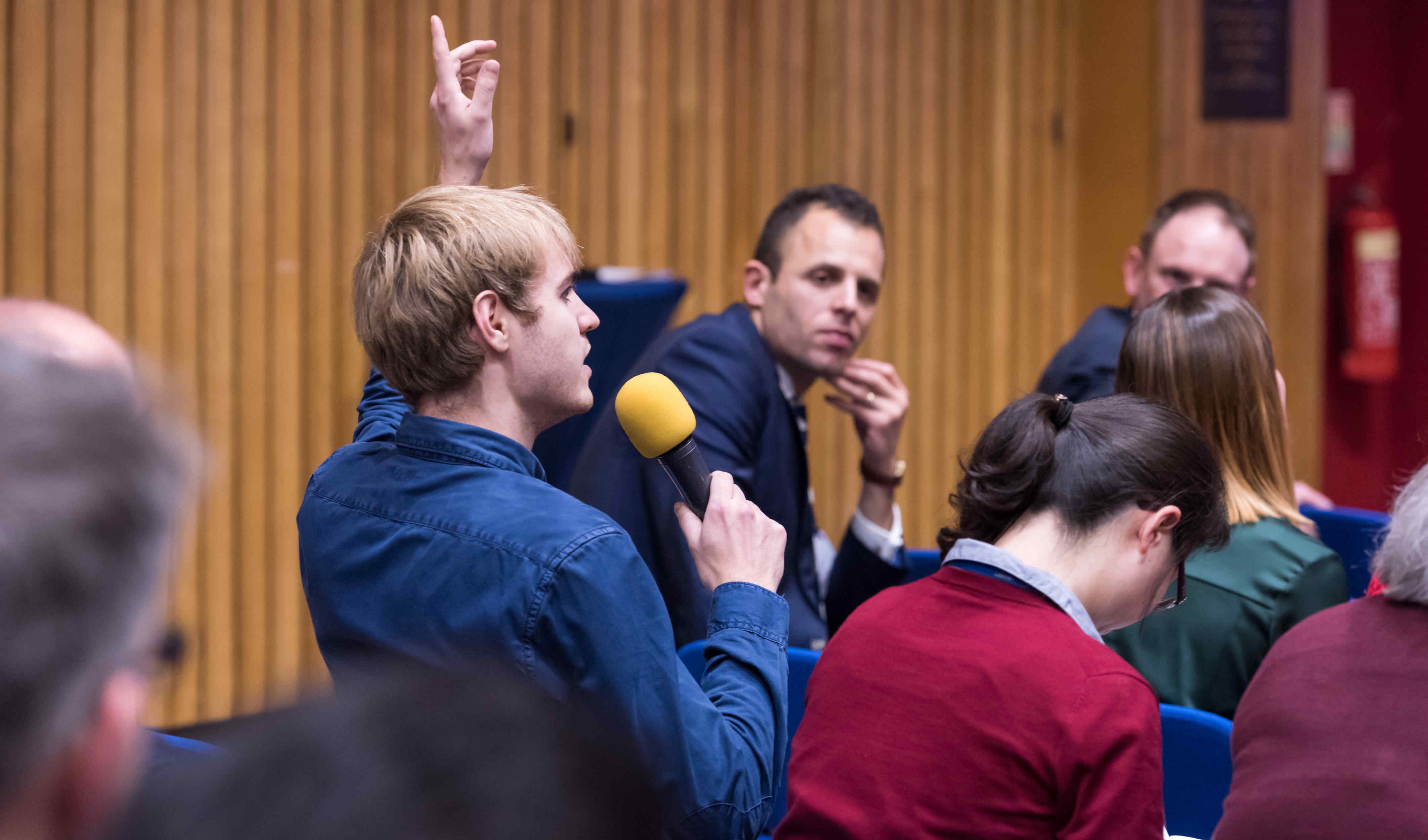 Members of the audience were encouraged to ask questions of the panels.