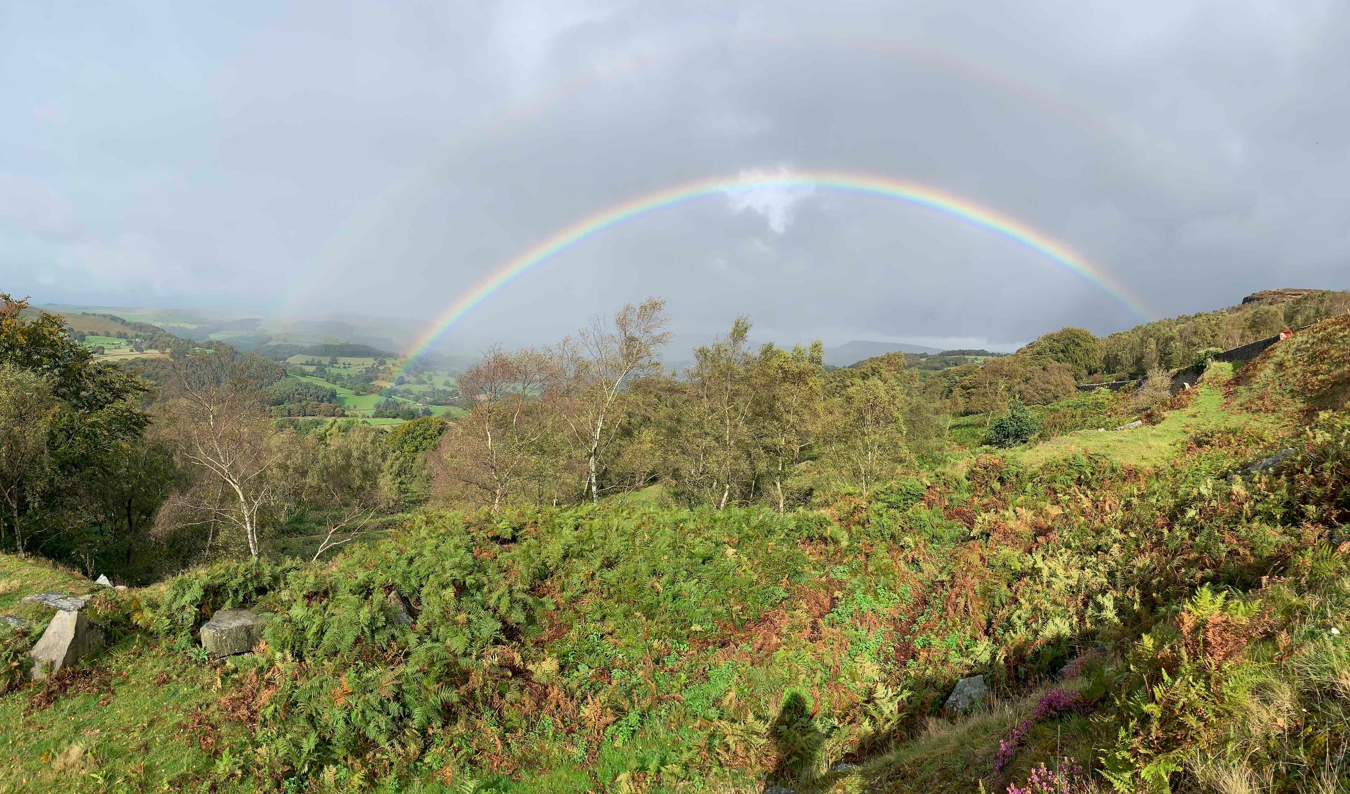 Peak district with double rainbow