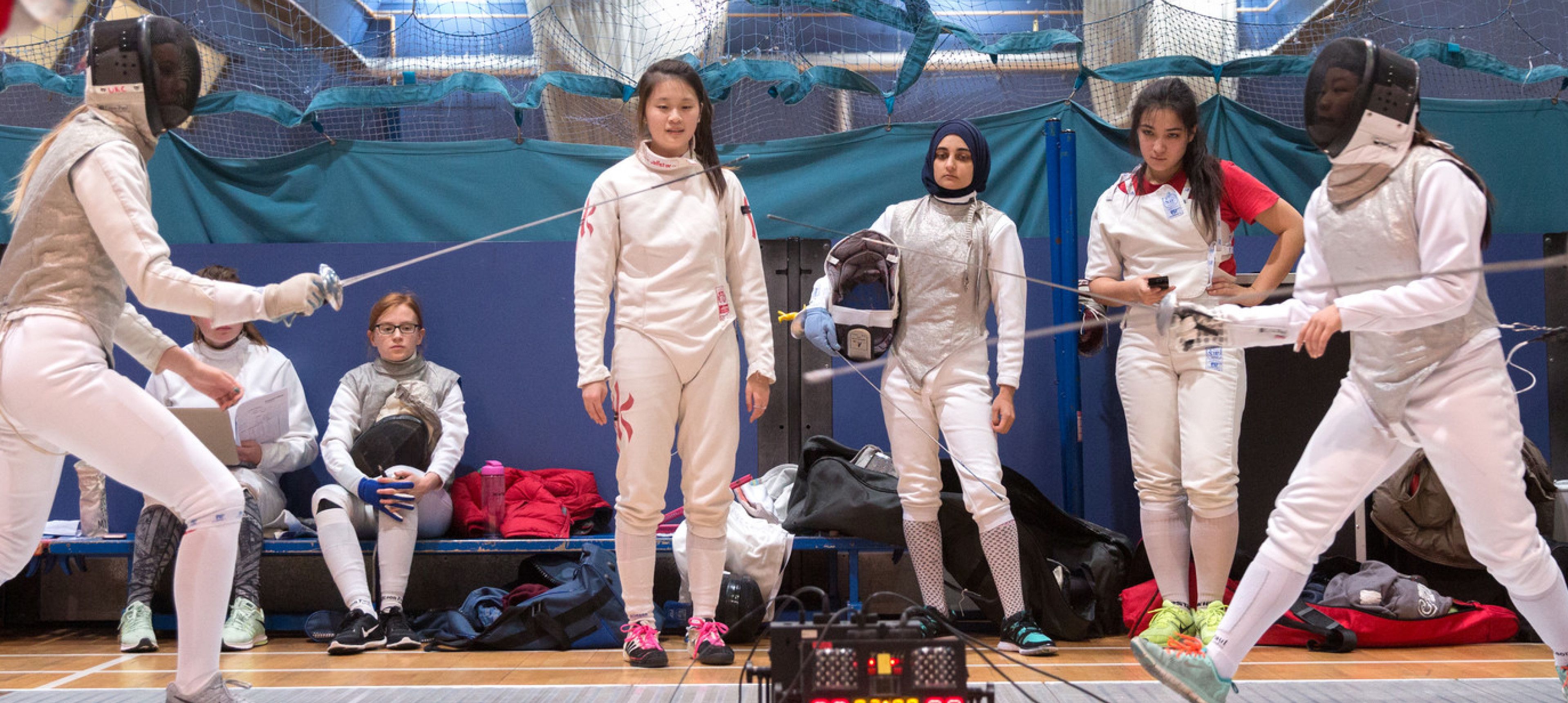 Students participating in a fencing competition in Ethos sports centre