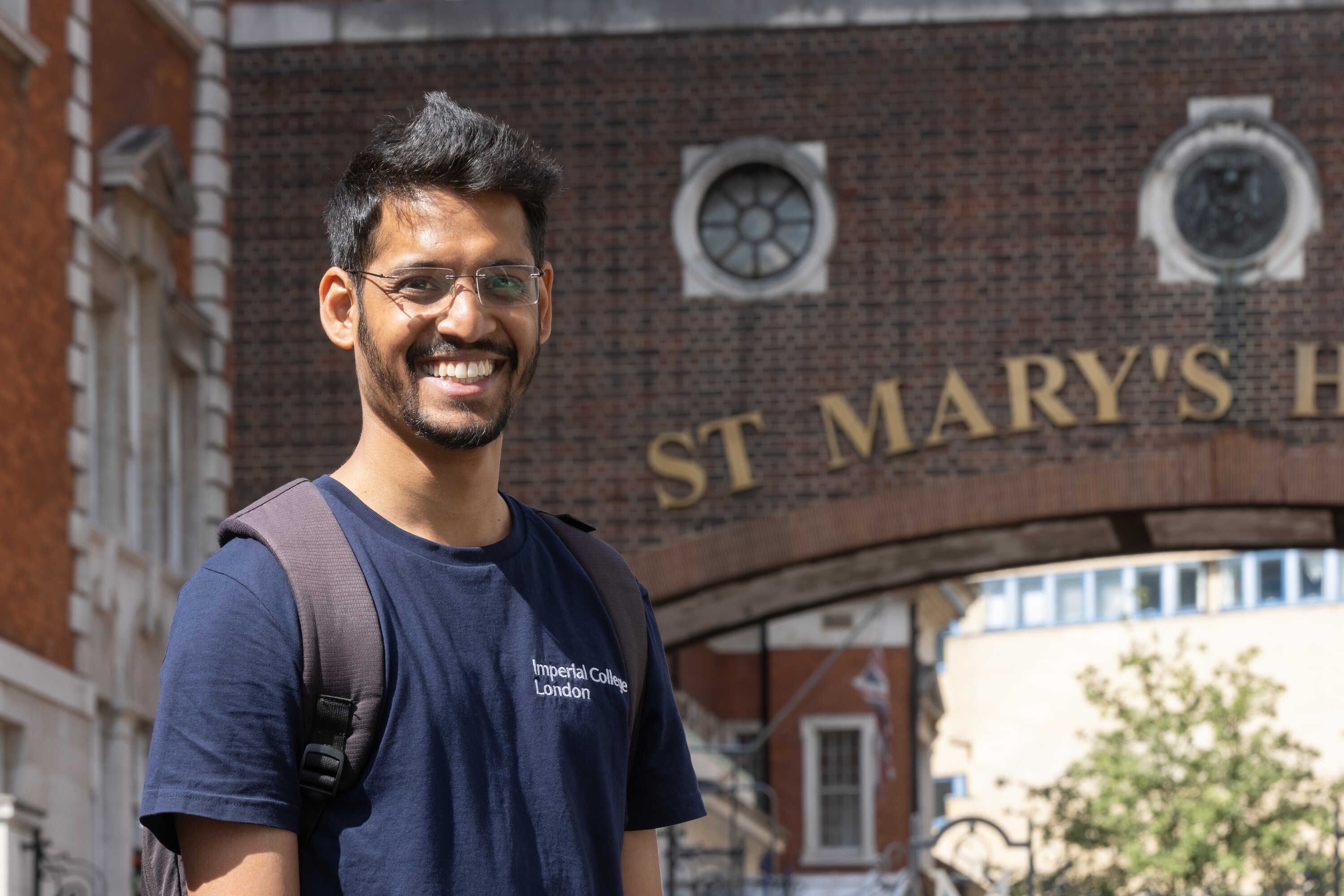Researcher standing outside St Mary's campus in London
