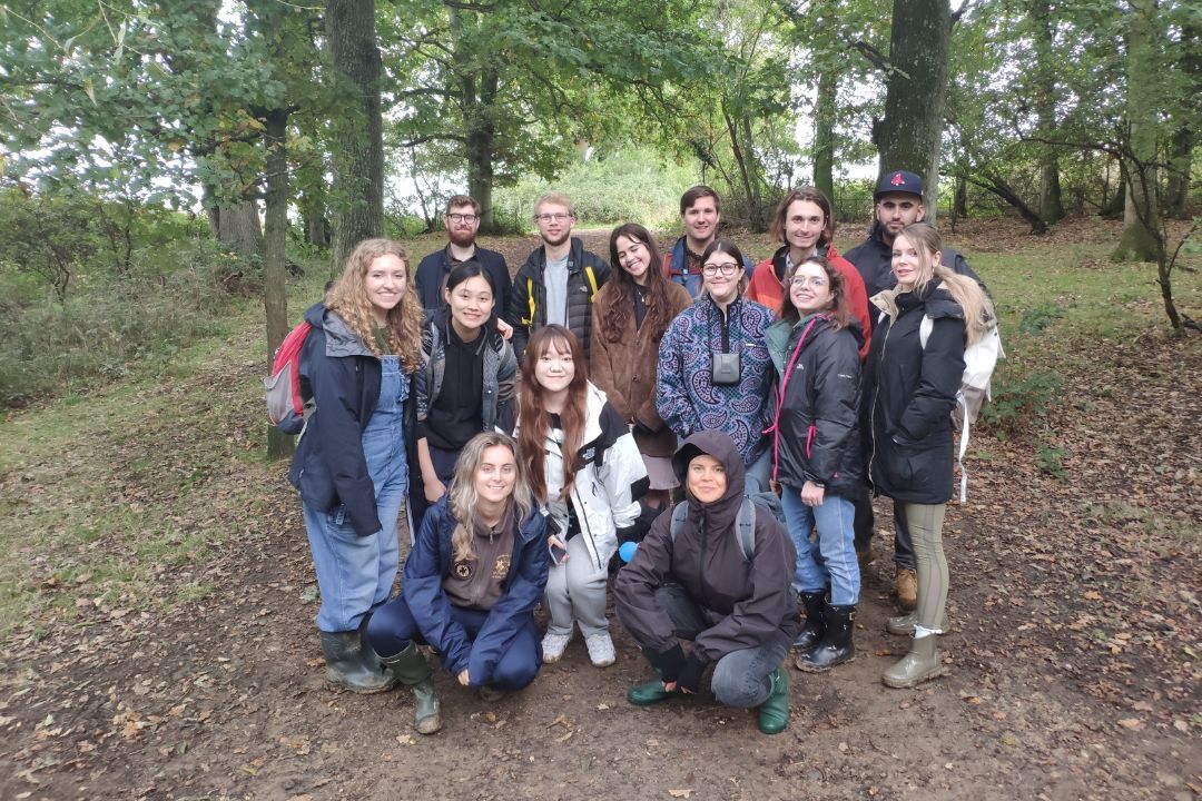 A group photo of all students in a forest on the fieldtrip in the Amazon