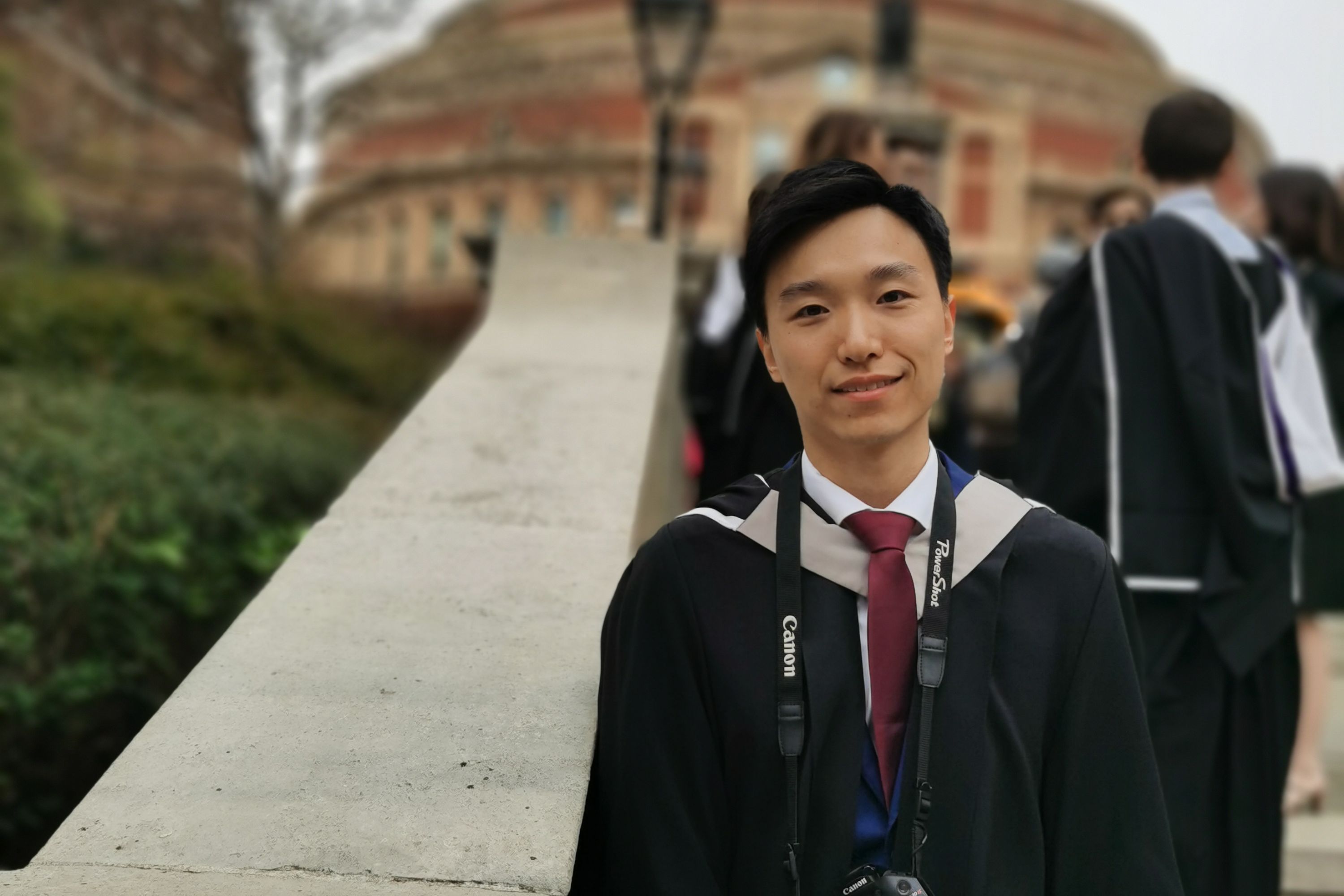 Griffin Gui in graduation gown outside Royal Albert Hall