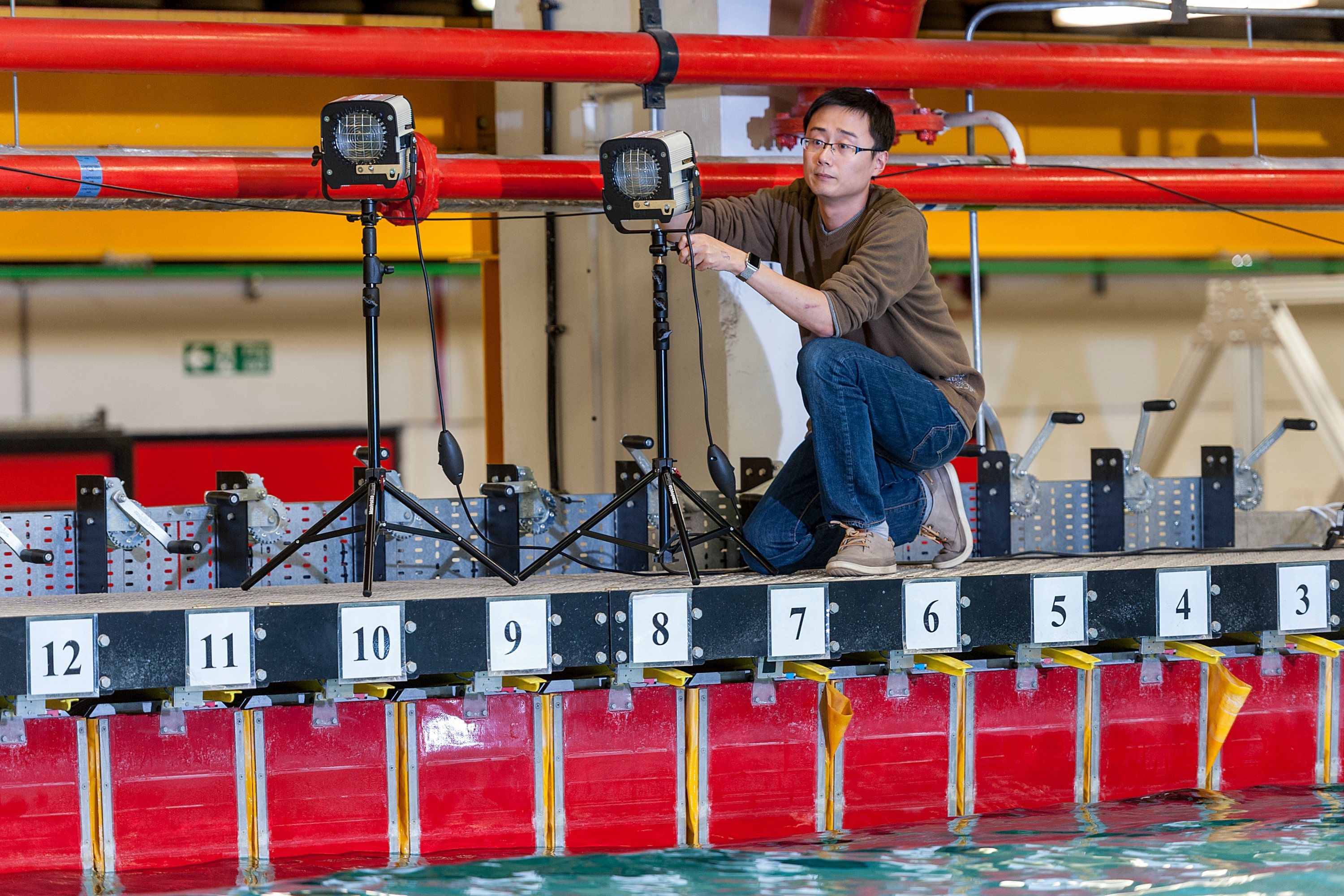 A student works in the Hydrodynamics laboratory at Imperial College London.