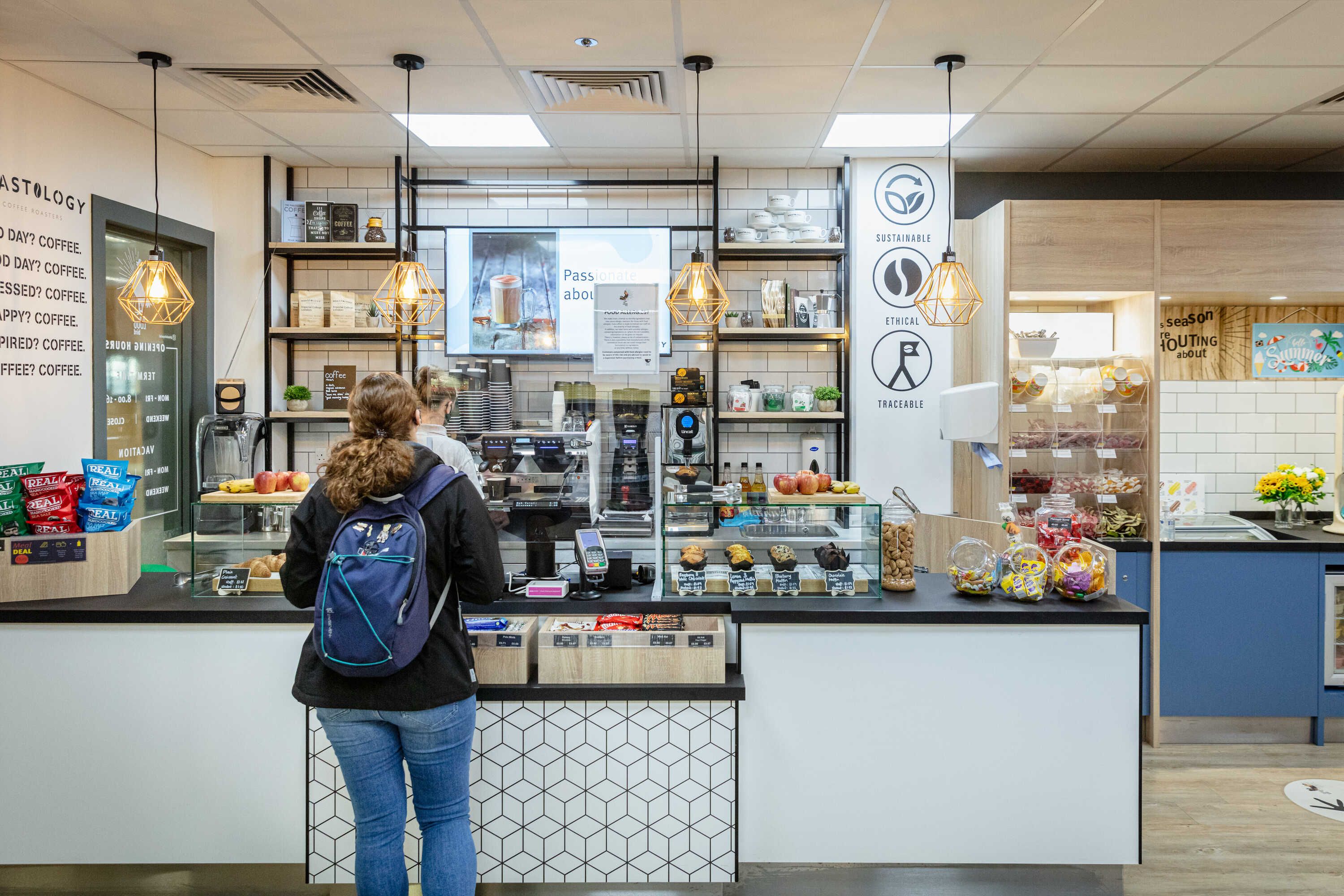 A student being served in the Loud Bird cafe in the Sir Alexander Fleming building