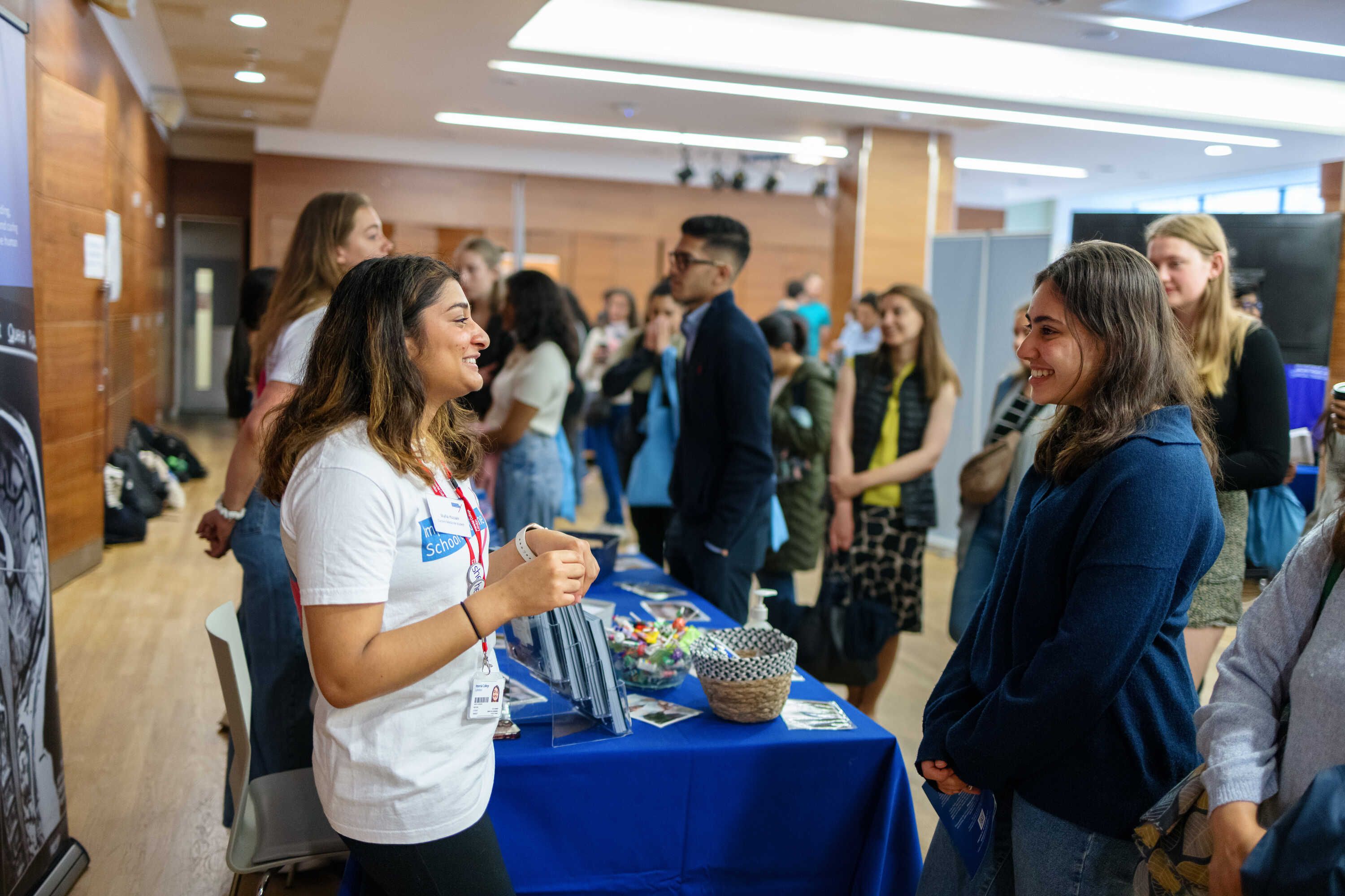 A student talking to a Medicine student at the Undergraduate Open Day