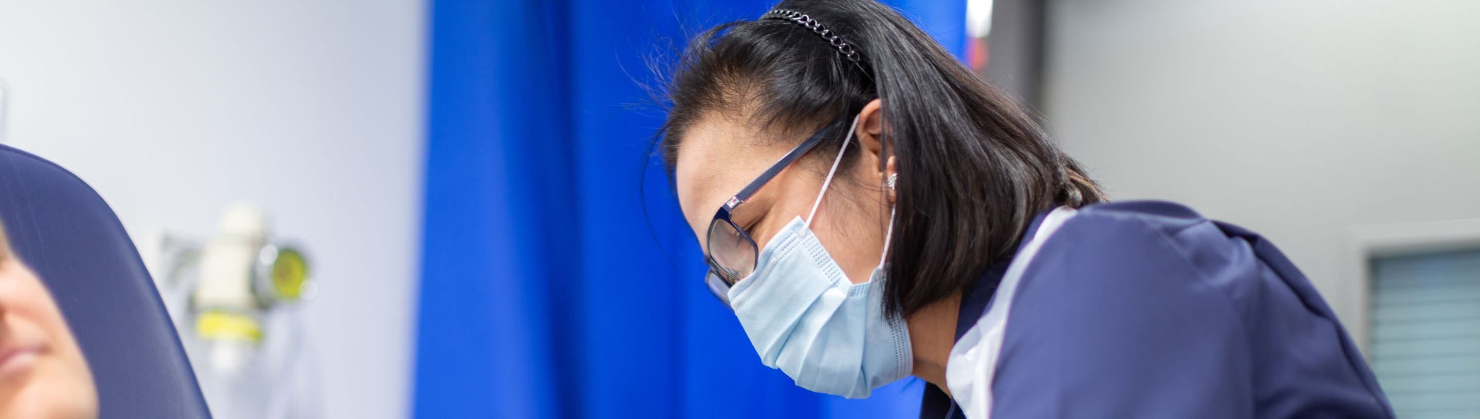 A nurse administers the new vaccine, ChAdOx1 nCoV-19 to a volunteer