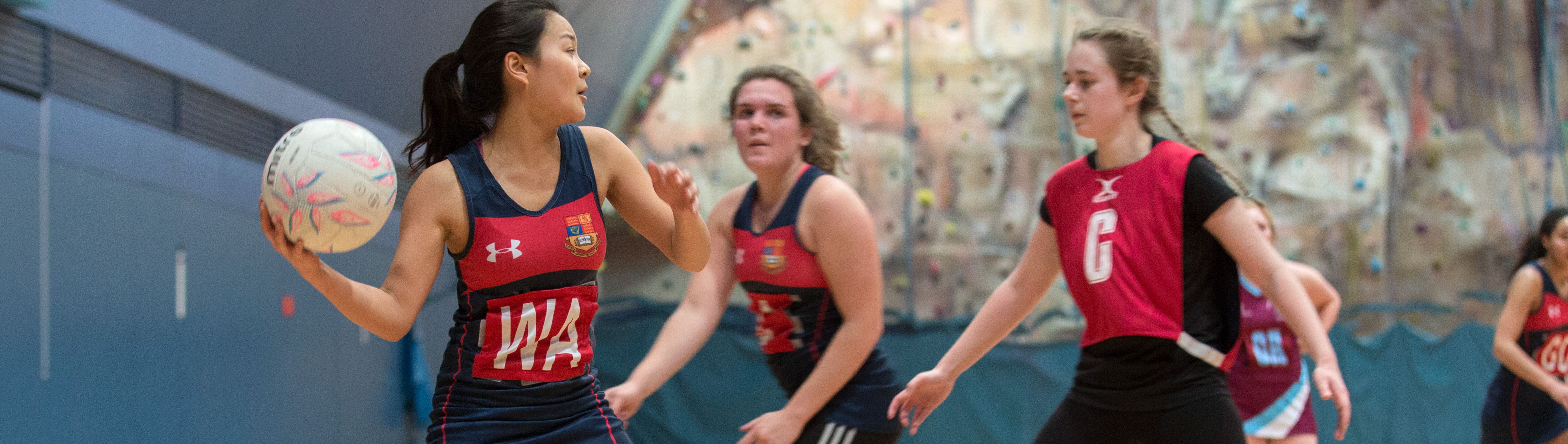 Students playing netball in Ethos Sports Hall