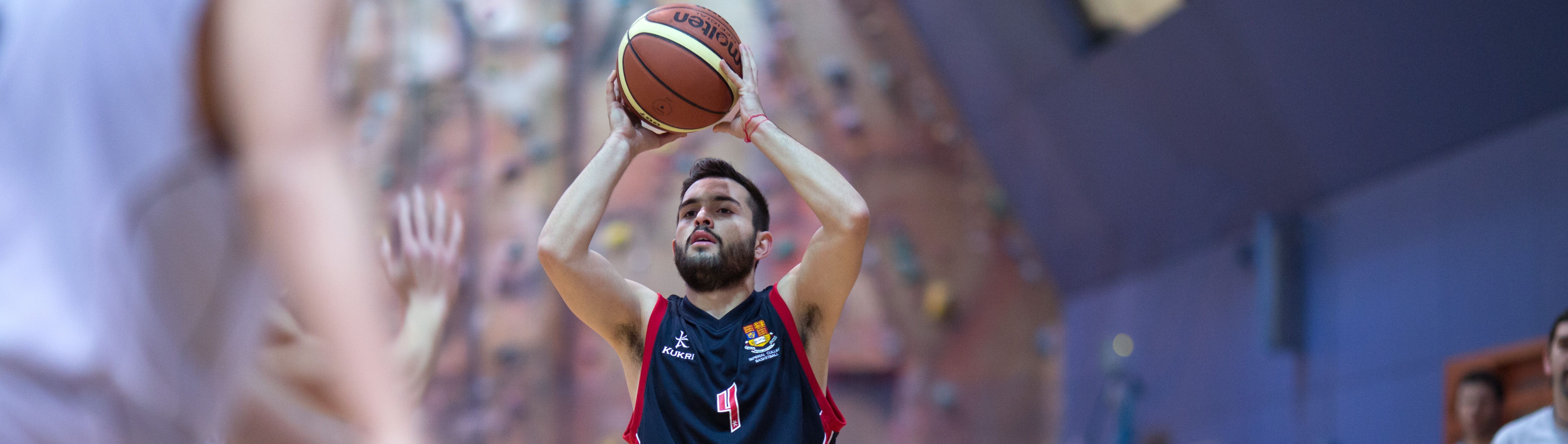 Student playing basketball in Ethos Sports Hall