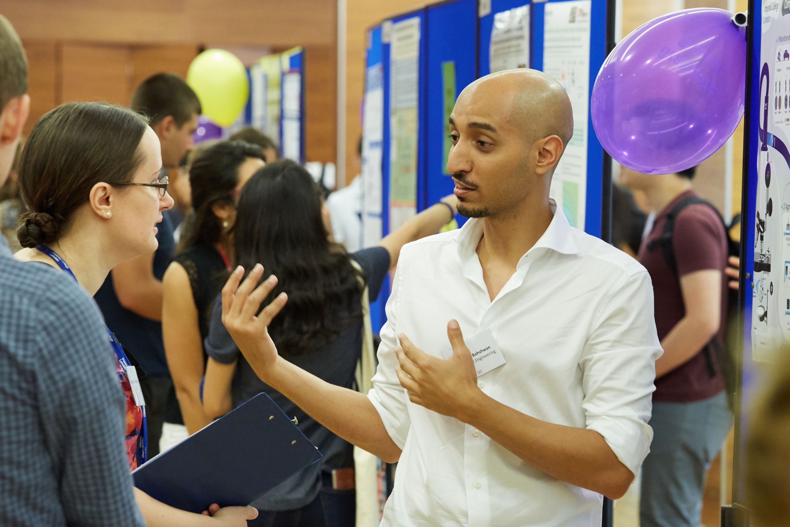 PhD student presenting poster