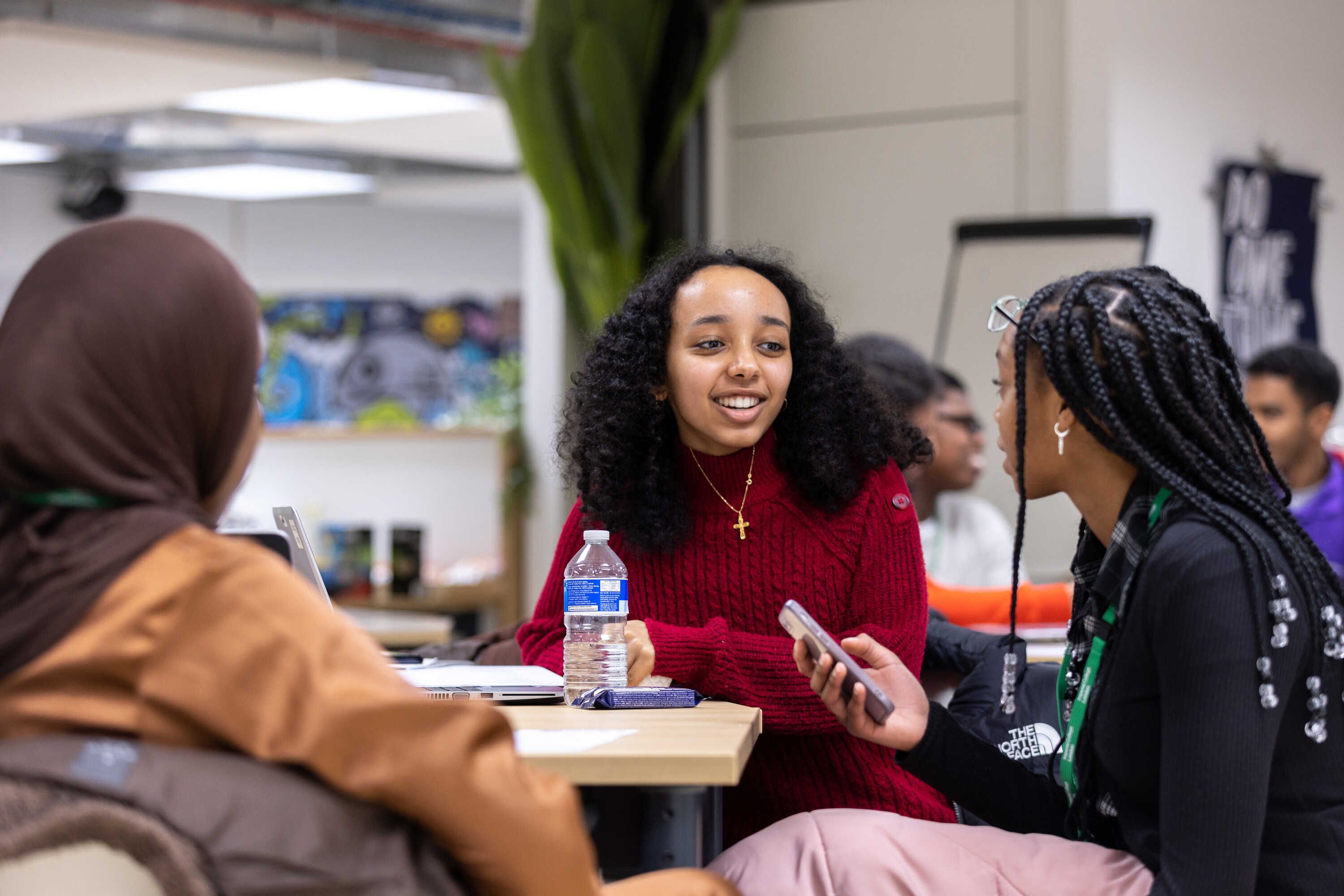 three students from black heritage background talking