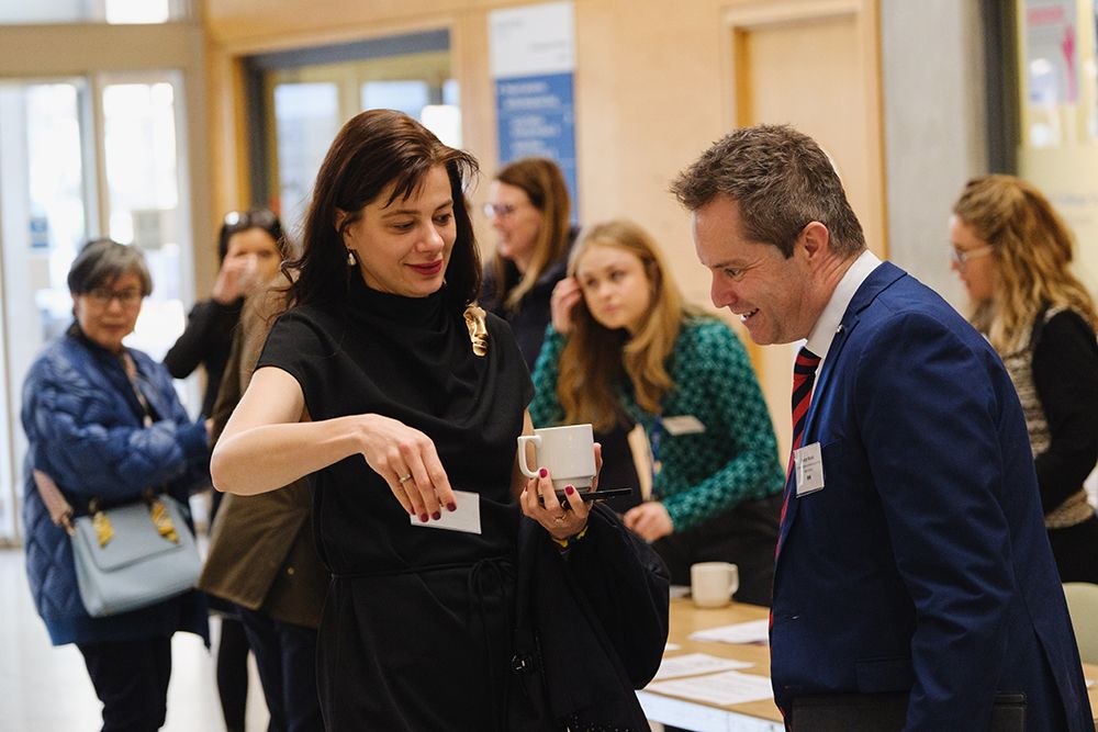 IGHI event - people arrive and collect name badge