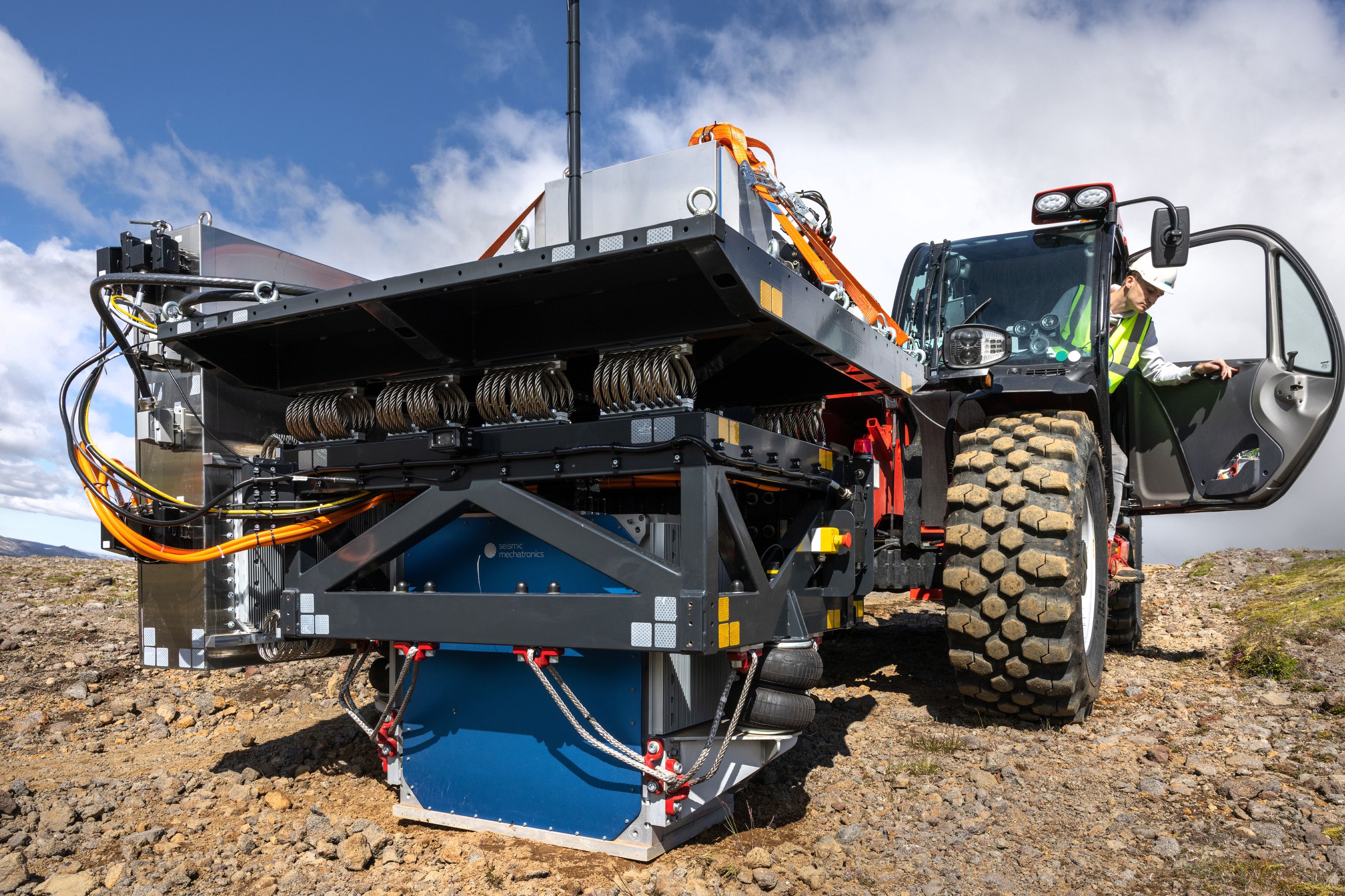 A modified tractor with seismology equipment attached