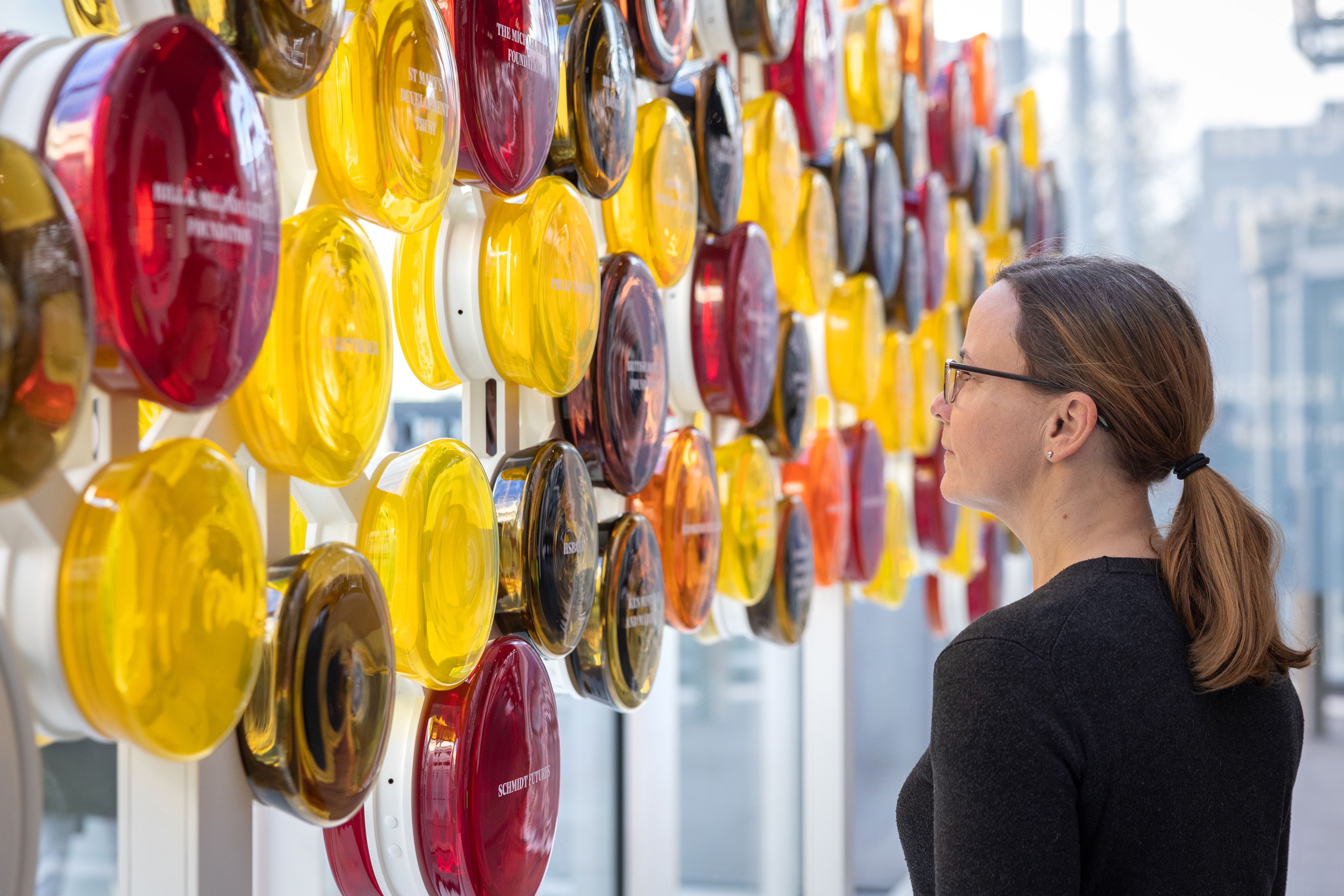 The Circle of Benefactors exhibition in the College's Main Entrance, which consists of circles of coloured glass with the names of donors printed on