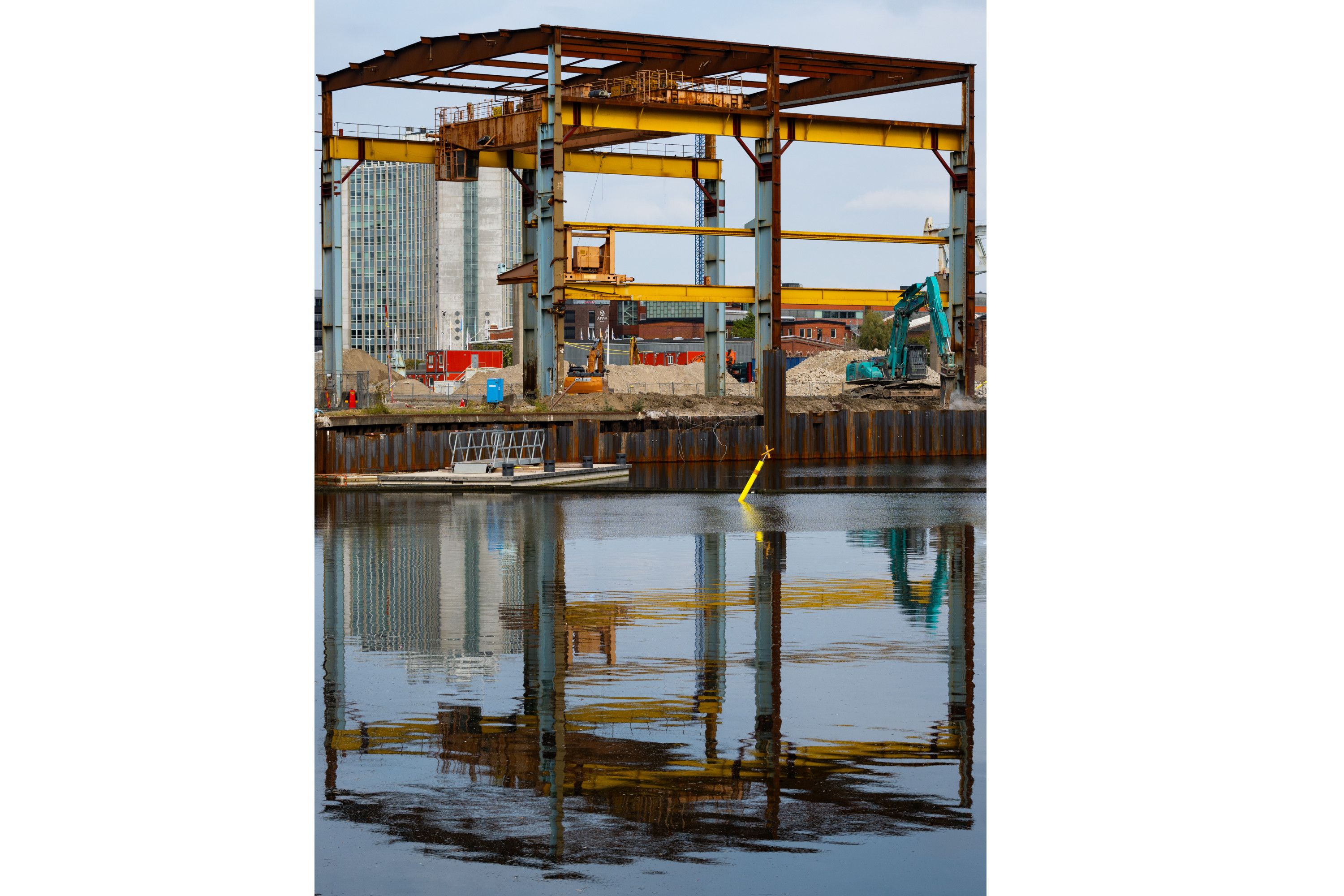 a construction site and reflection in water