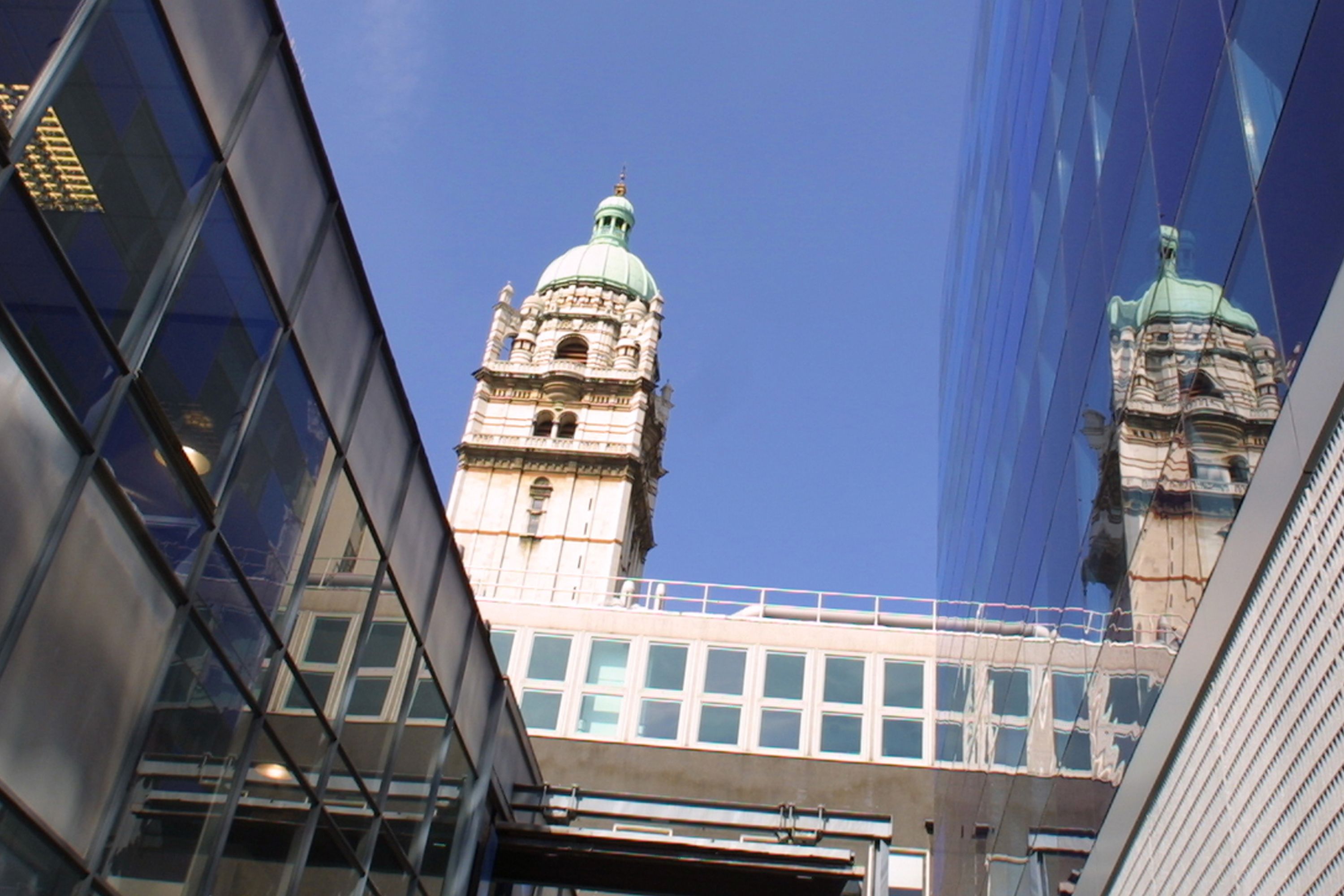 Queen's Tower reflected in nearby buildings