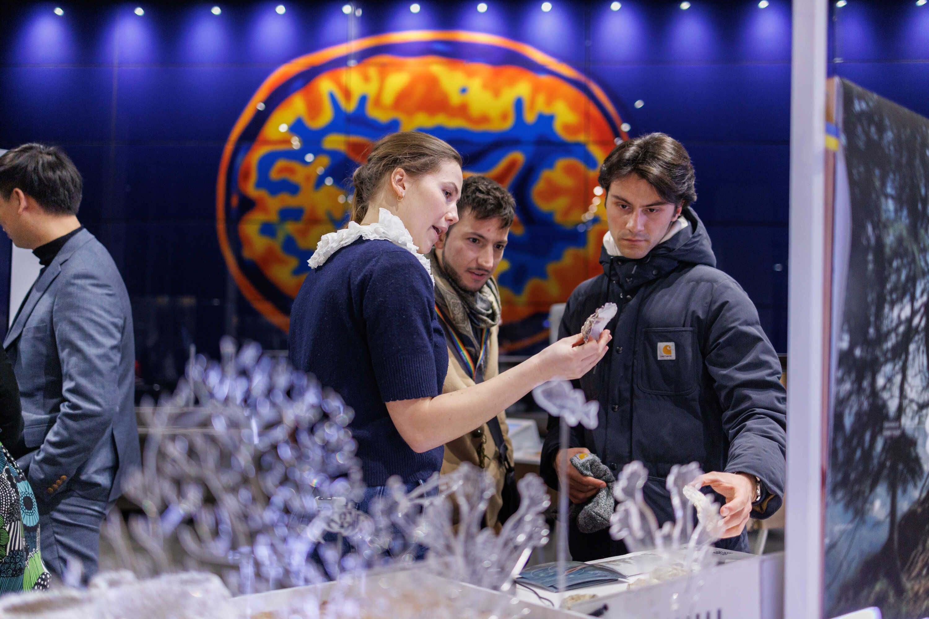 People inspecting an exhibit at the Design engineering spring show