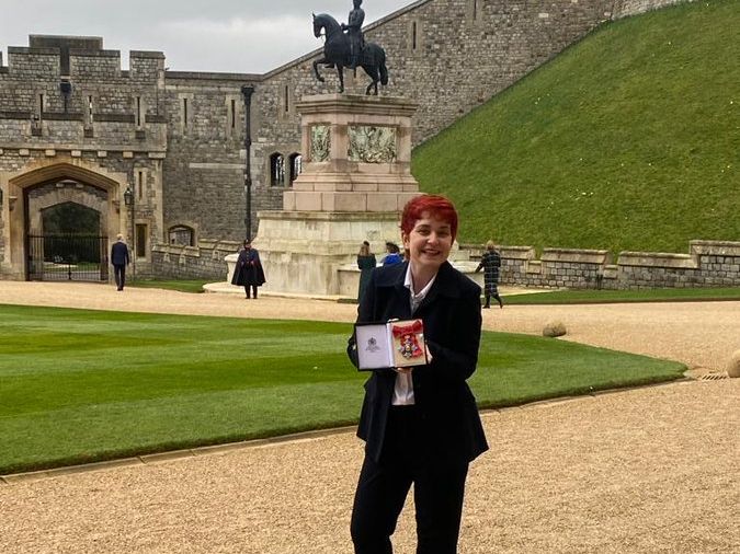 Professor Ryan picking up her CBE in Windsor